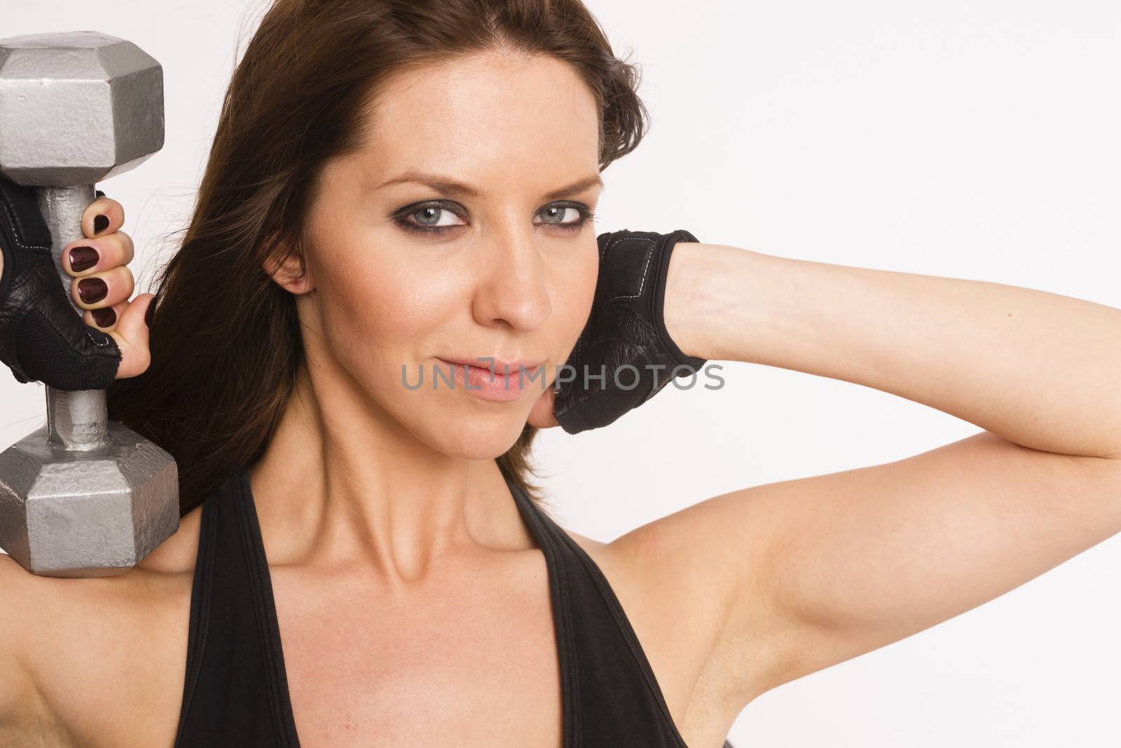 Attractive Brunette Woman Working Out Curling Barbells White Background by ChrisBoswell