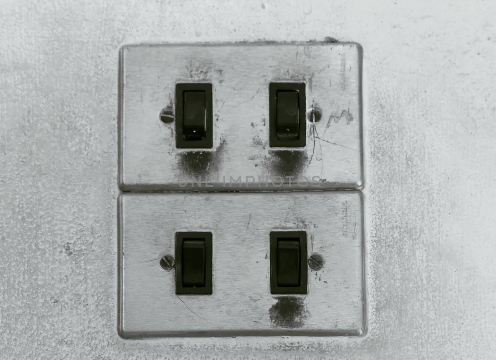 Old switch on white wall by sutipp11