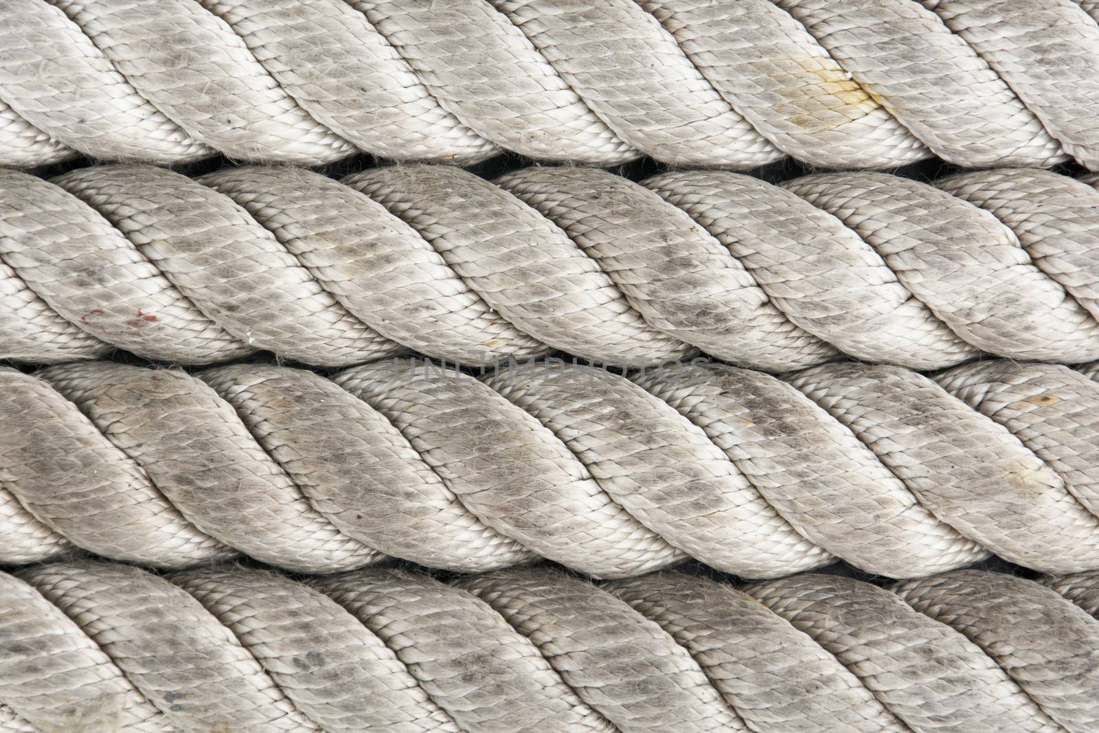 close up of large nylon ropes on a ship