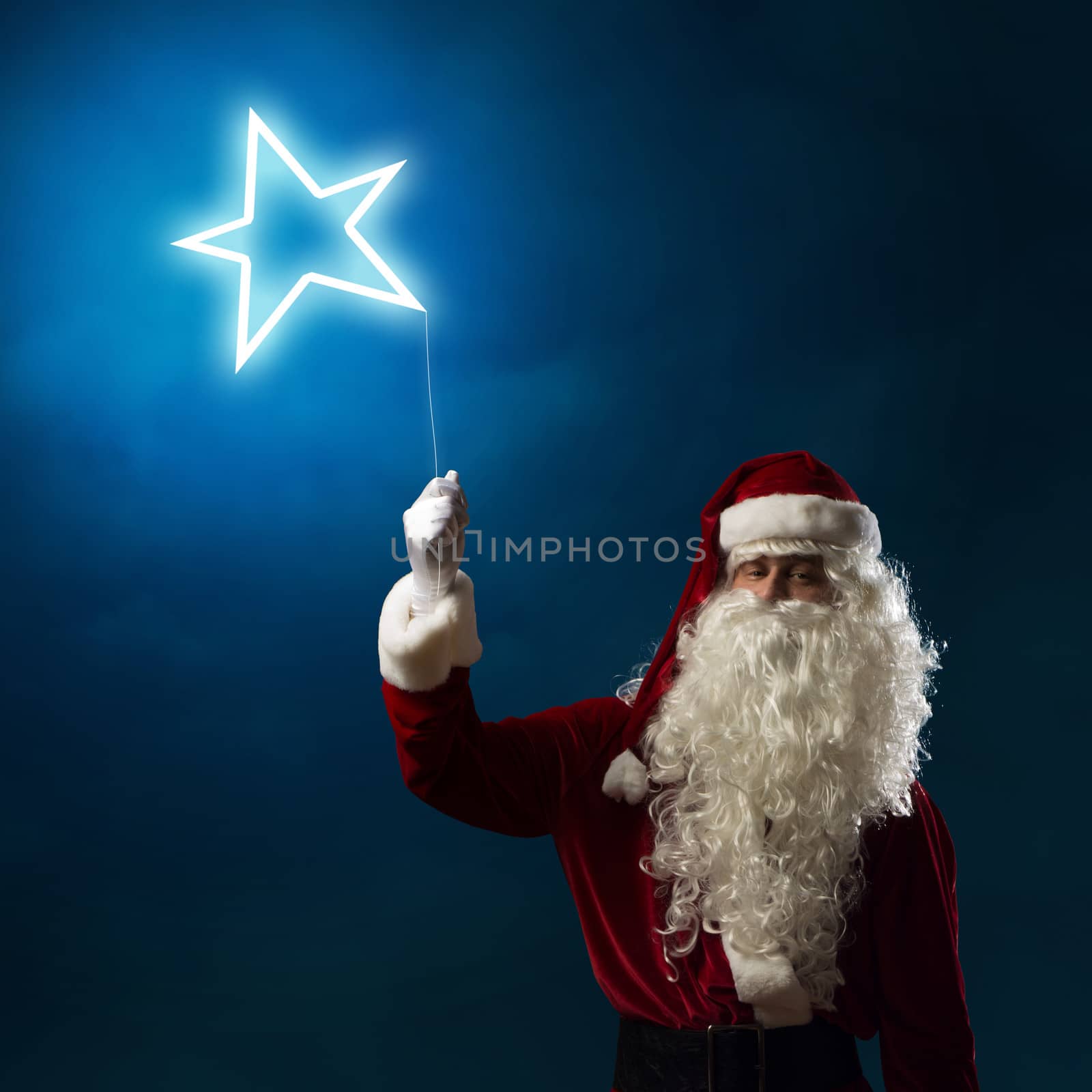 Santa Claus holding a light symbol of the star by adam121