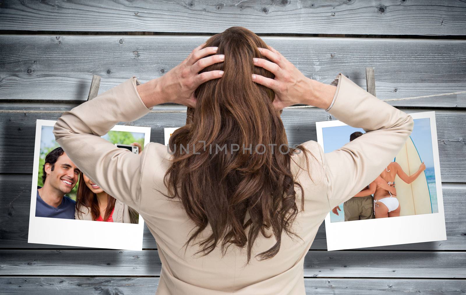 Composite image of young classy businesswoman with hands on head standing back to camera by Wavebreakmedia