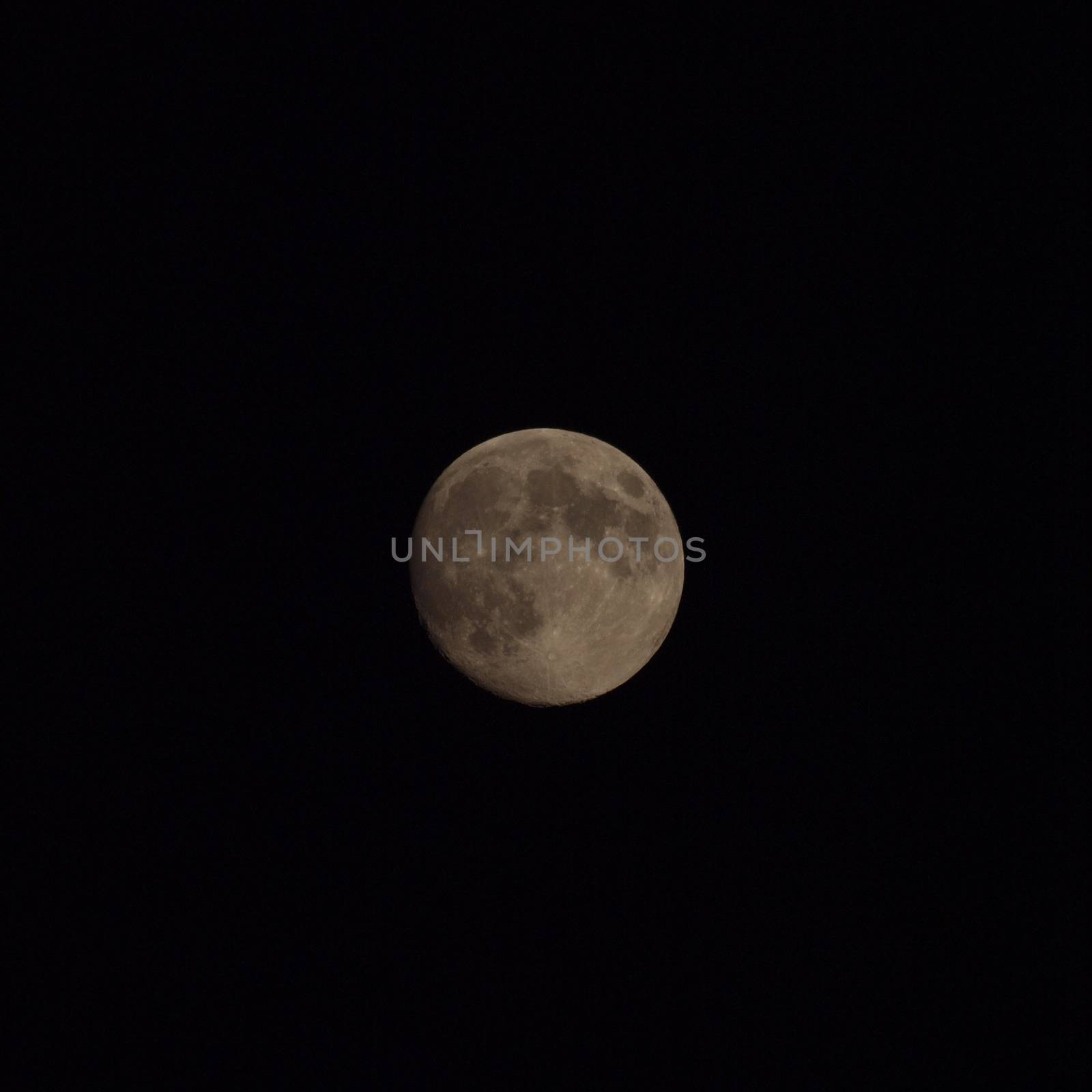 Moon at night over the black sky