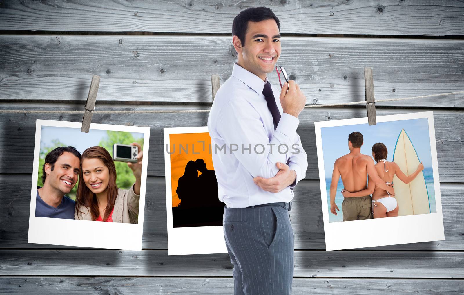 Composite image of smiling businessman holding glasses by Wavebreakmedia