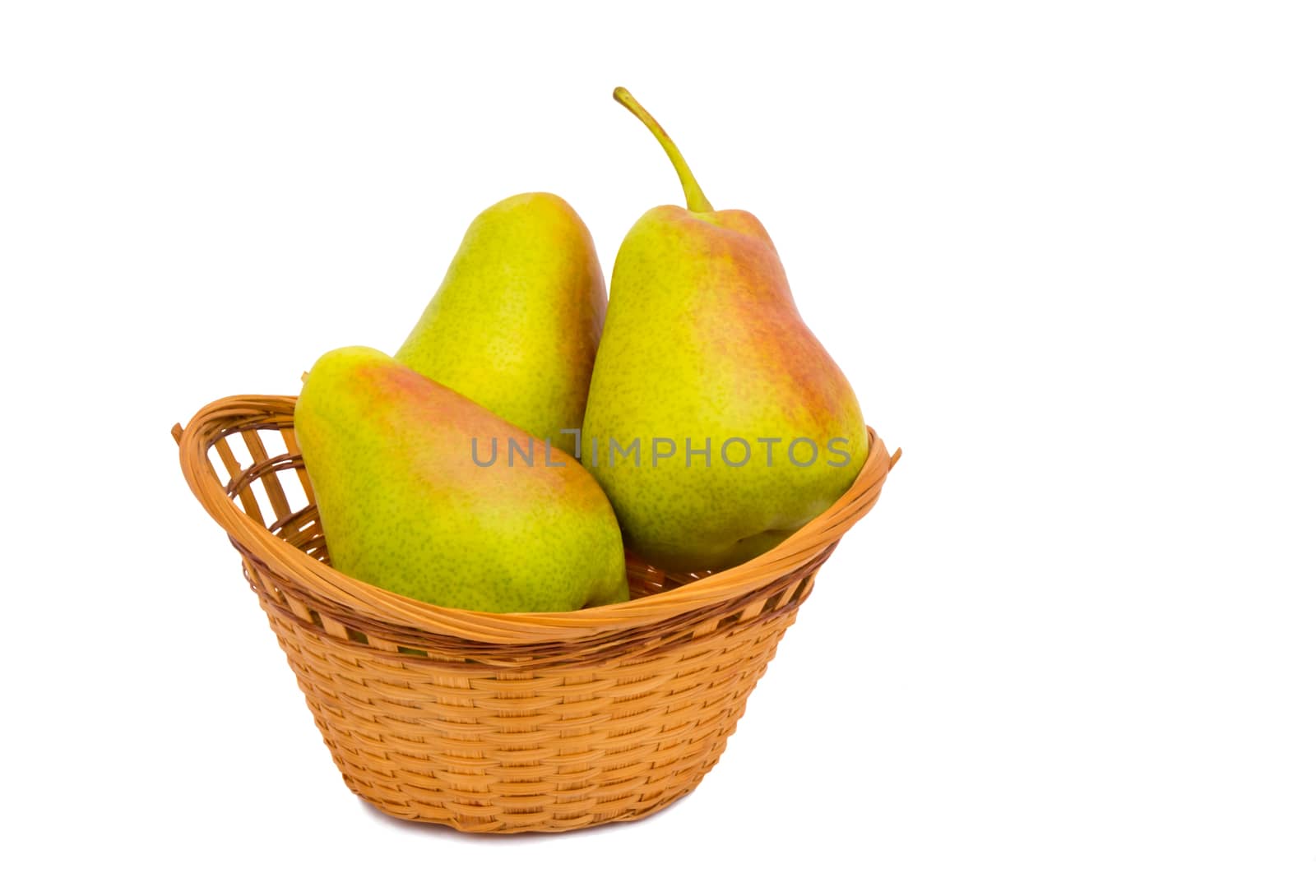 Large ripe pears in a wicker basket on a white background. by georgina198