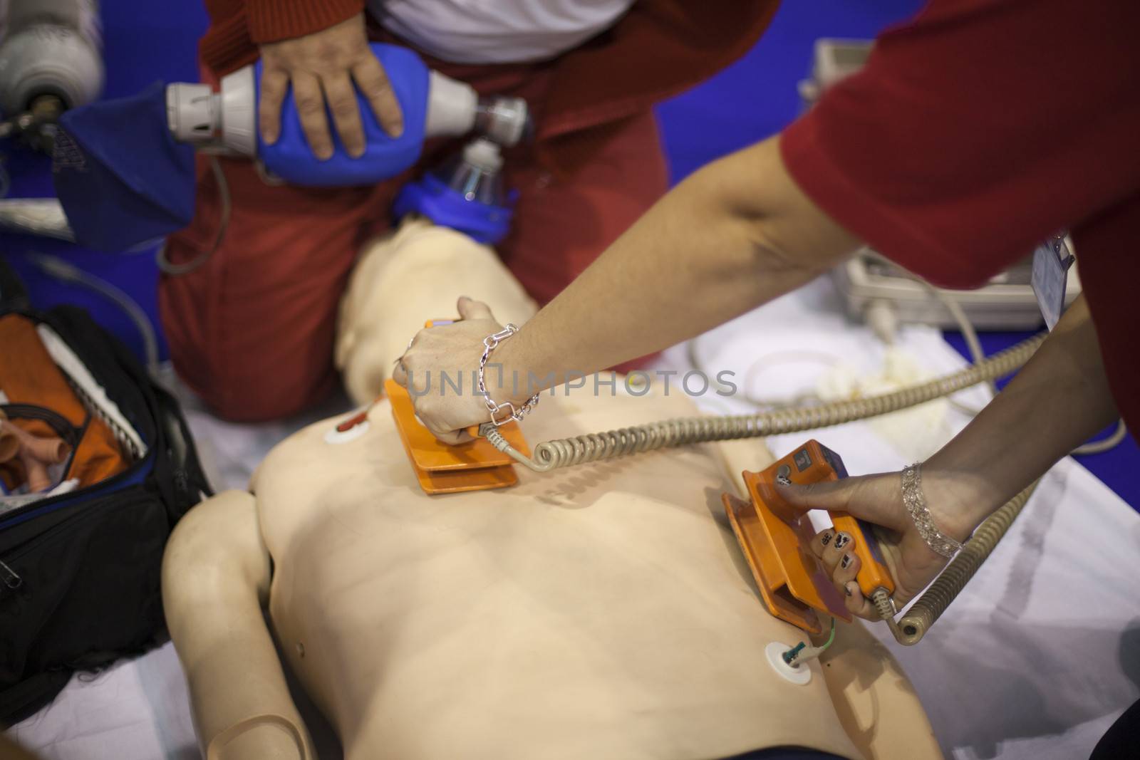 Paramedic demonstrates CPR on dummy