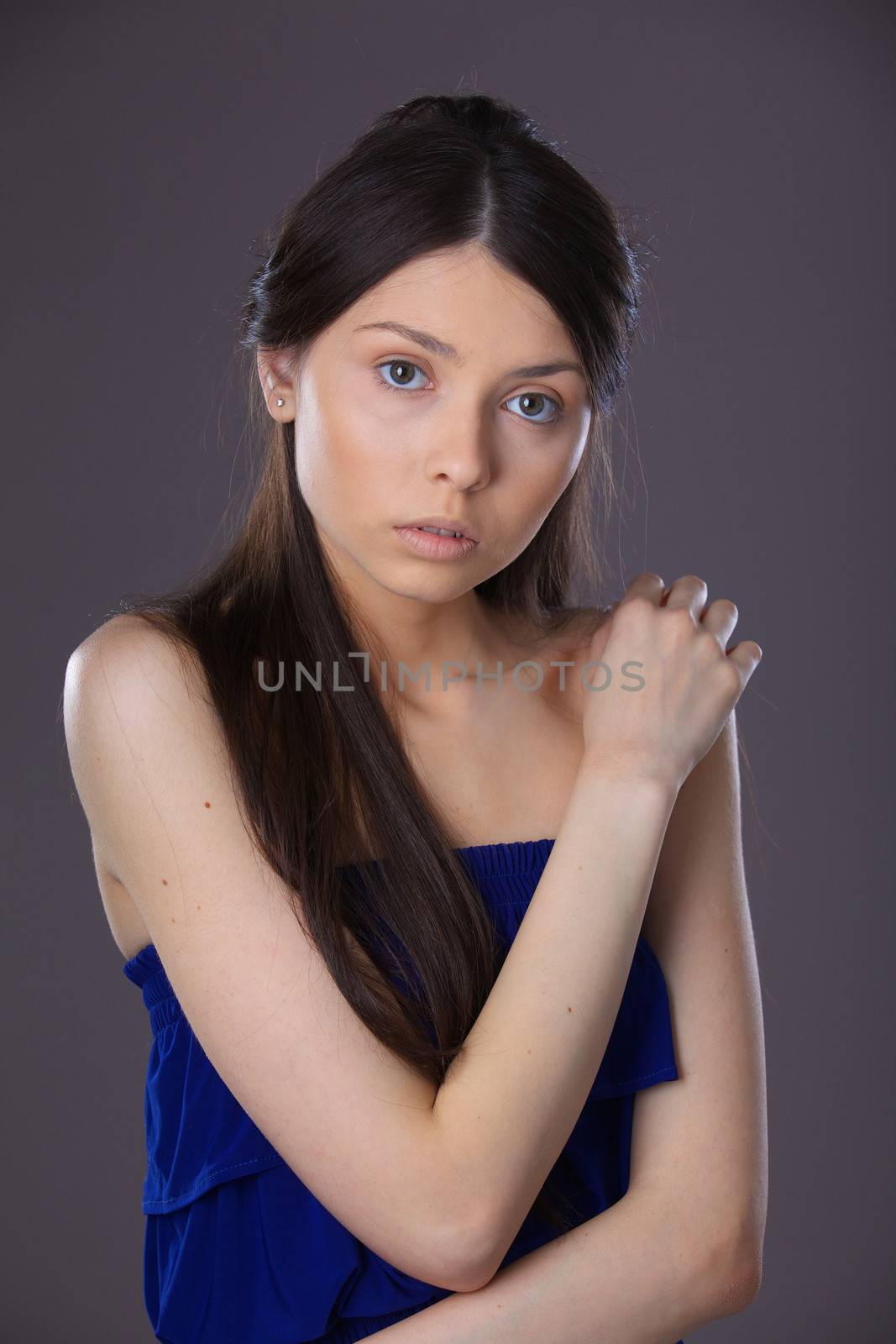 Glamour portrait of beautiful woman model with fresh daily makeup and romantic hairstyle.