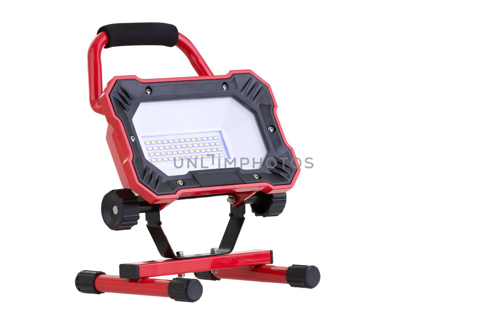 Red portable battery operated metal LED work light isolated on white