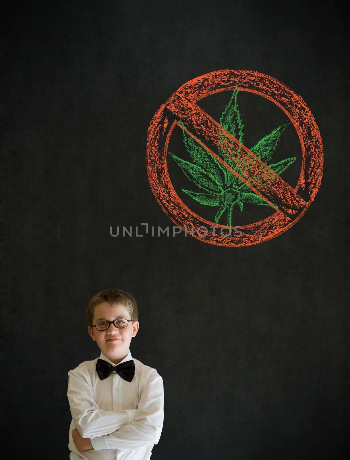 Thinking boy dressed up as business man with no weed marijuana on blackboard background