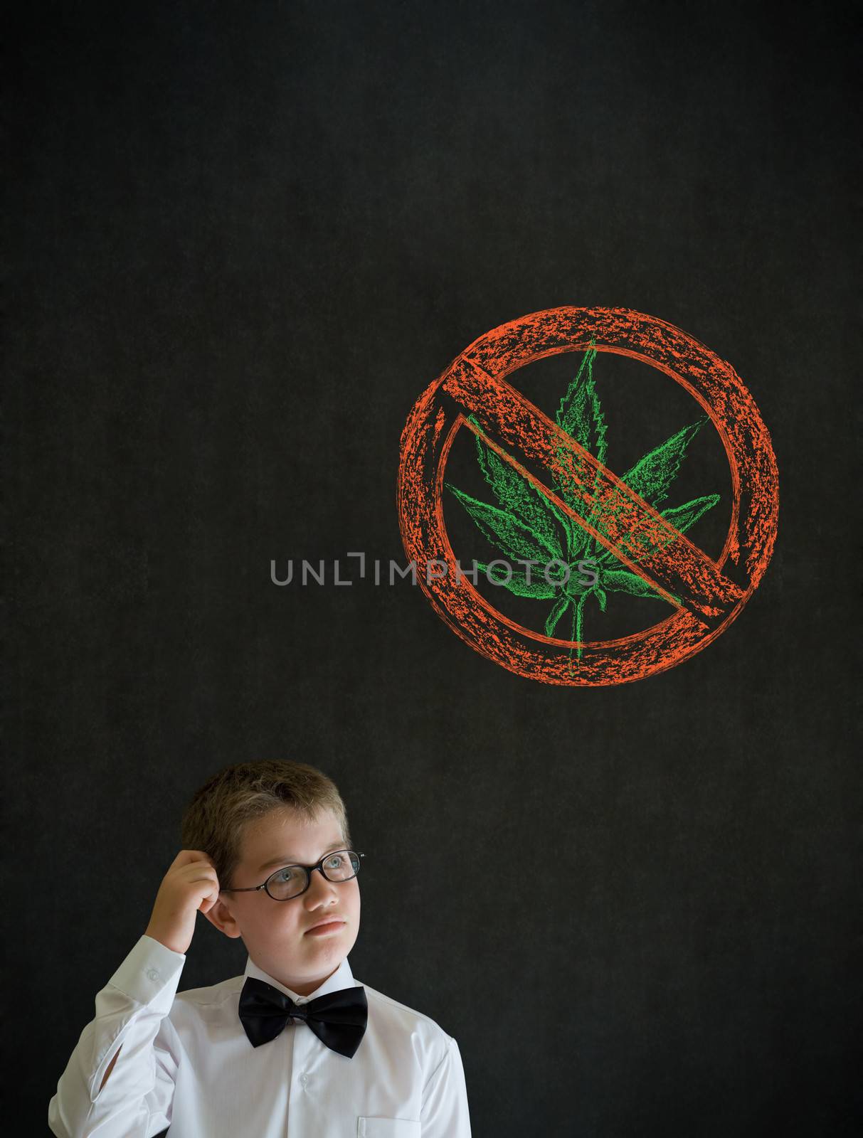 Scratching head thinking boy dressed up as business man with no weed marijuana on blackboard background