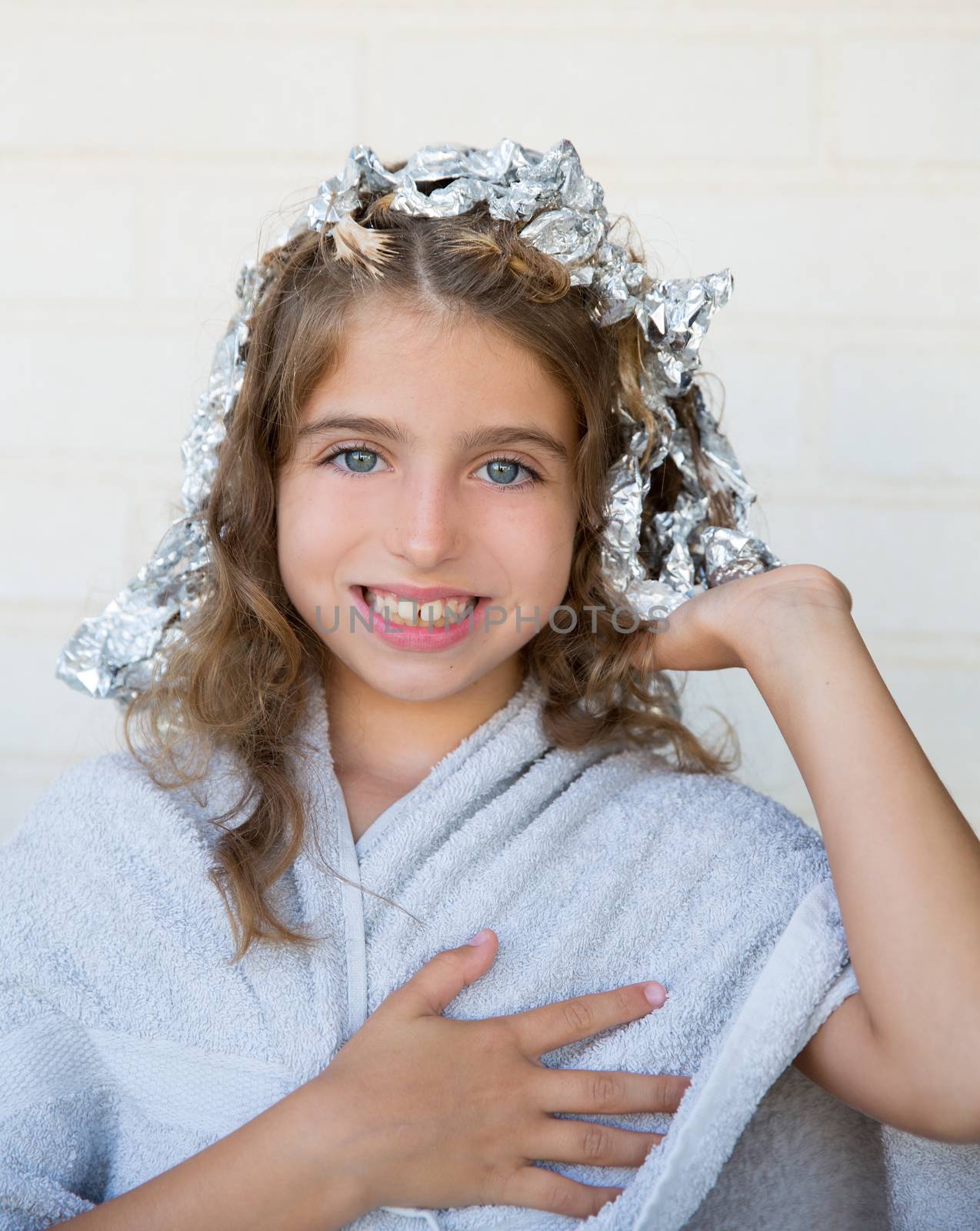 Funny kid girl smiling with his dye hair with foil by lunamarina