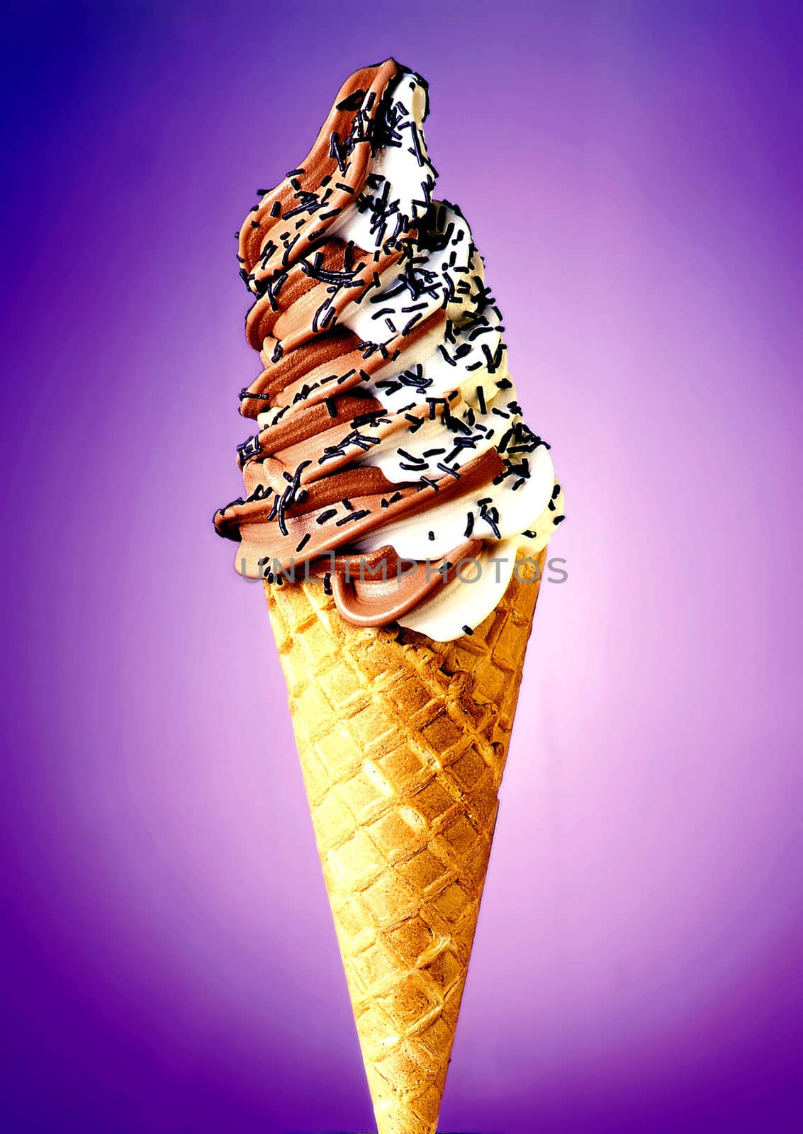 Mixed vanilla and chocolate flavour ice cream cone on gradient background.