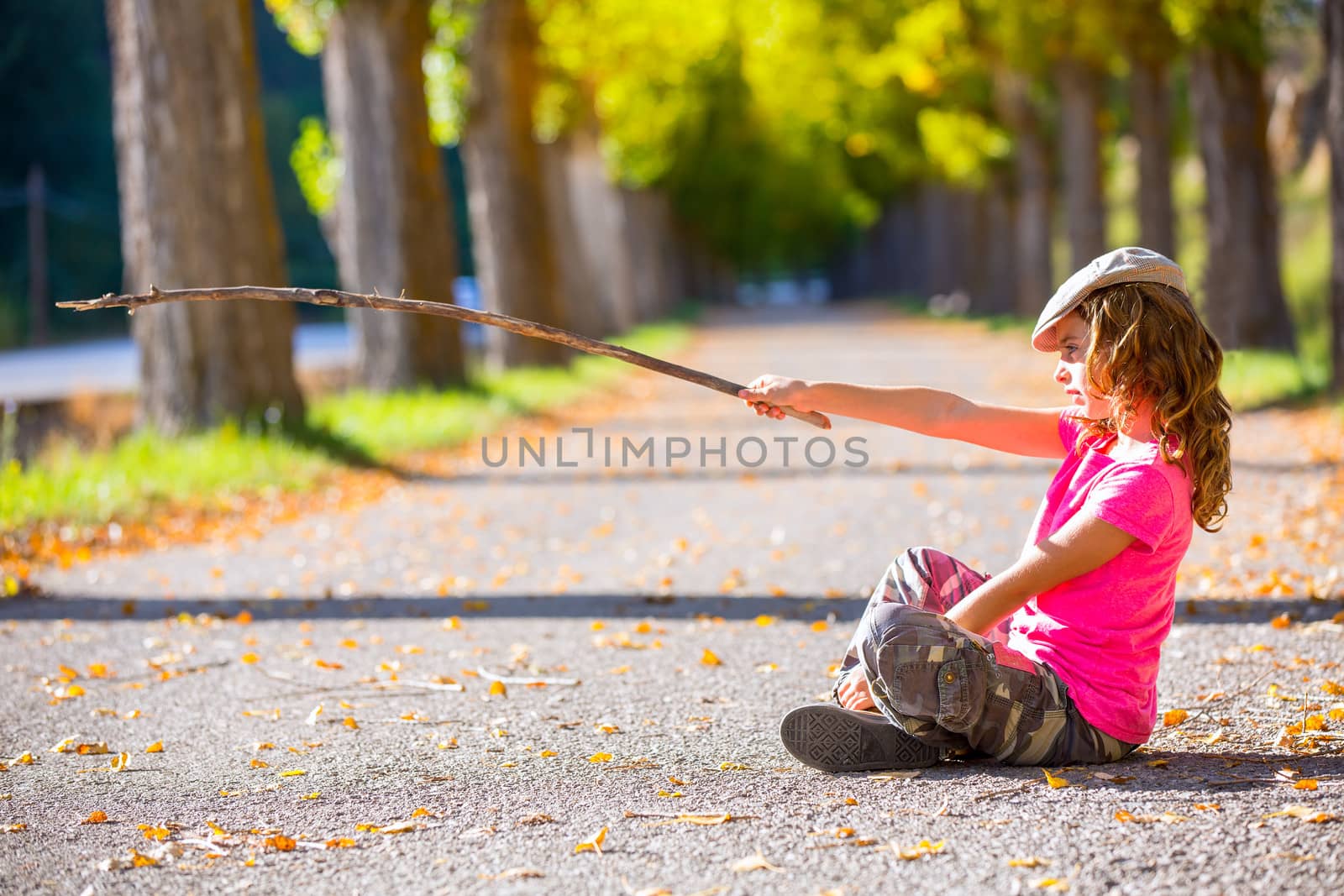 autumn kid girl with camouflage pants sitting in trees track by lunamarina