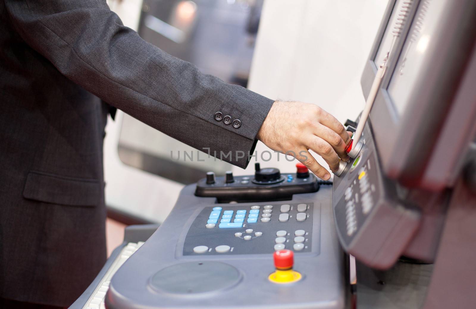 Man working at programmable machine