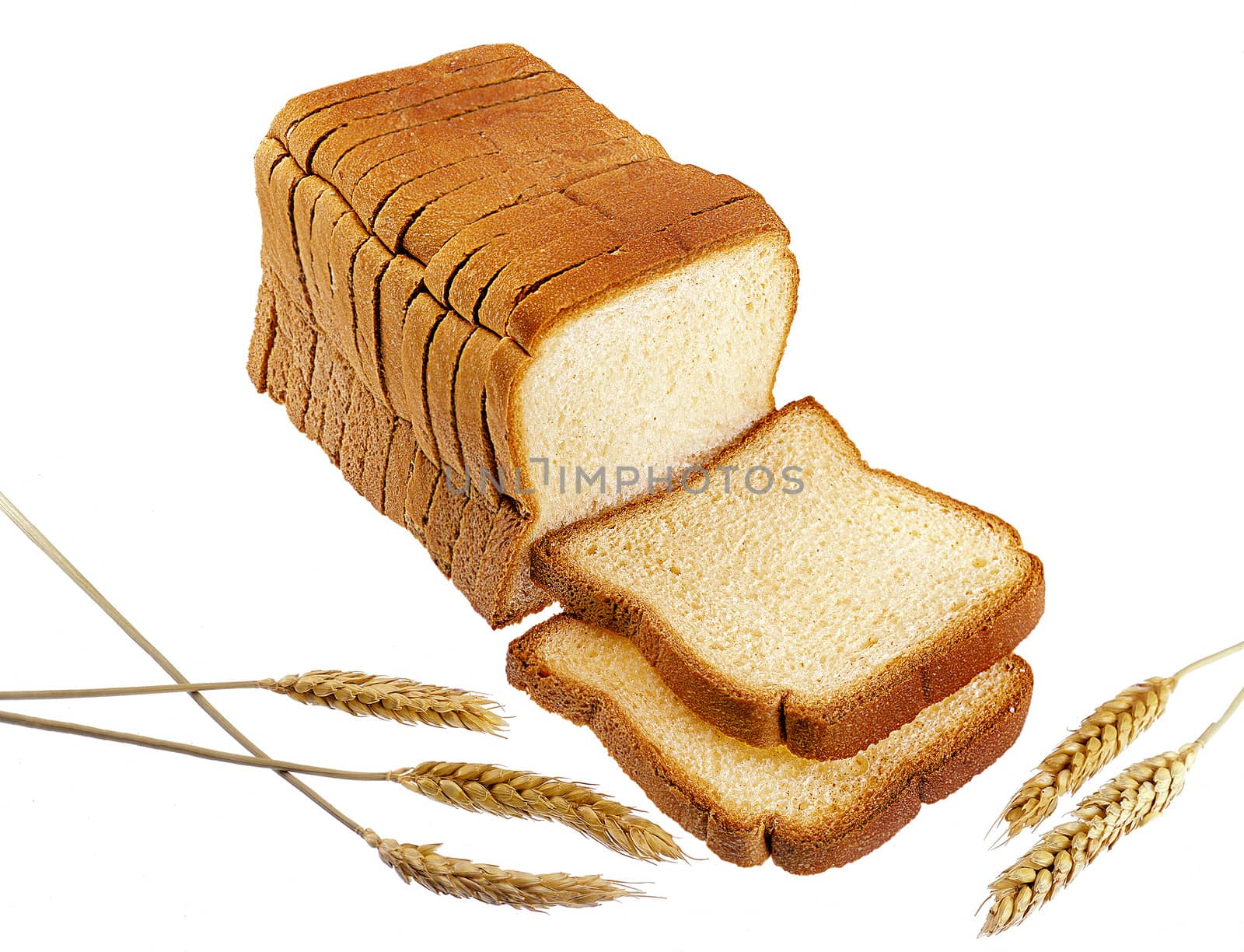 Sliced bread with wheat spikes - isolated