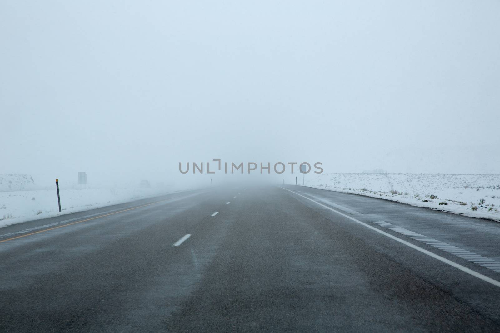 US snowing I 15 interstate snowed road in Nevada USA