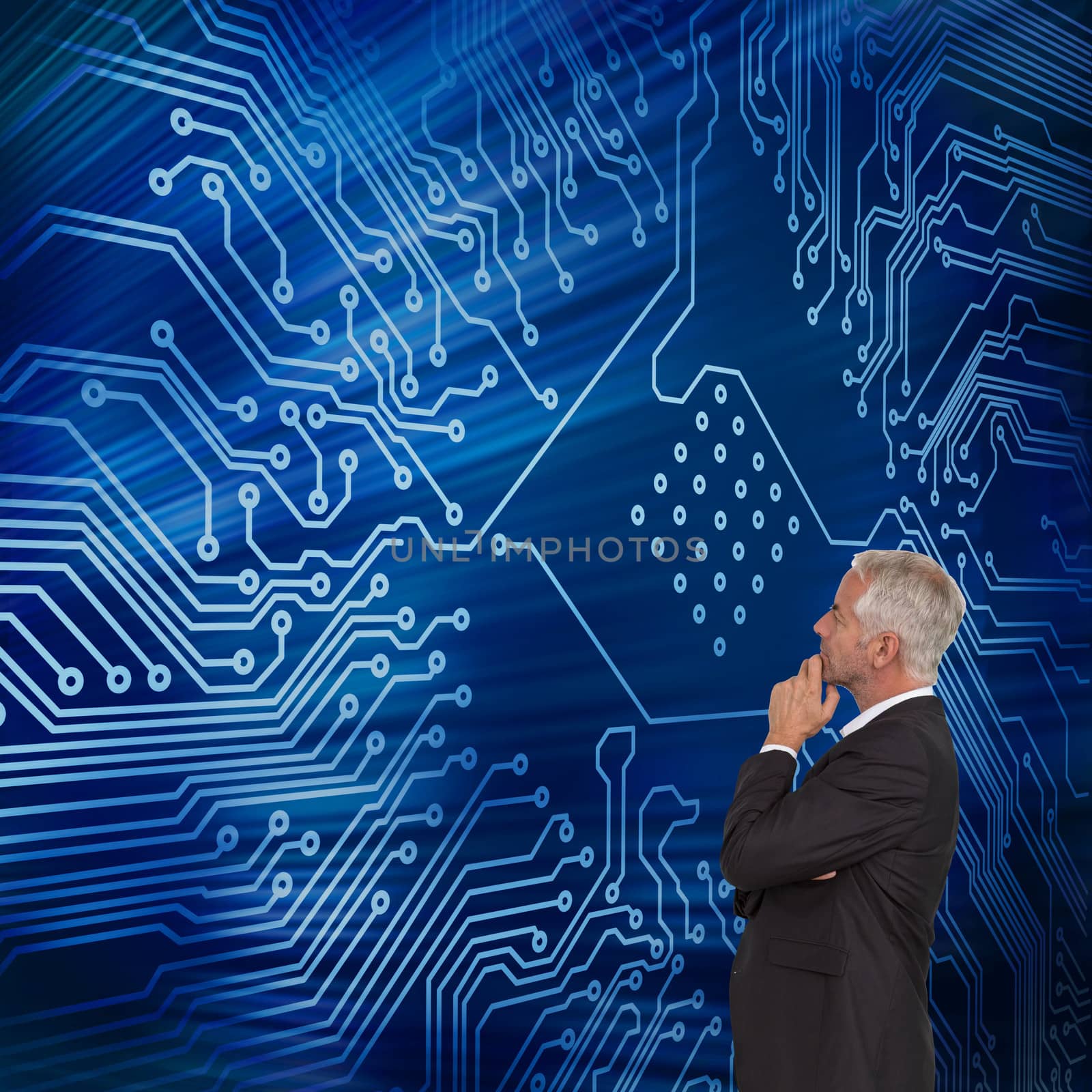 Composite image of thoughtful mature businessman posing by Wavebreakmedia