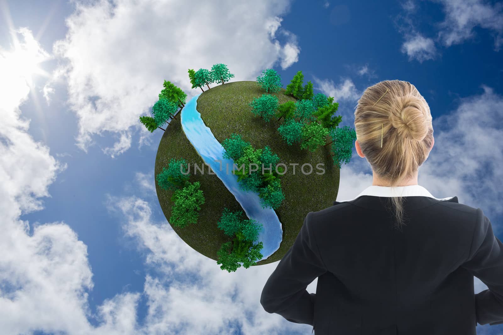 Composite image of blonde businesswoman standing with hands on hips