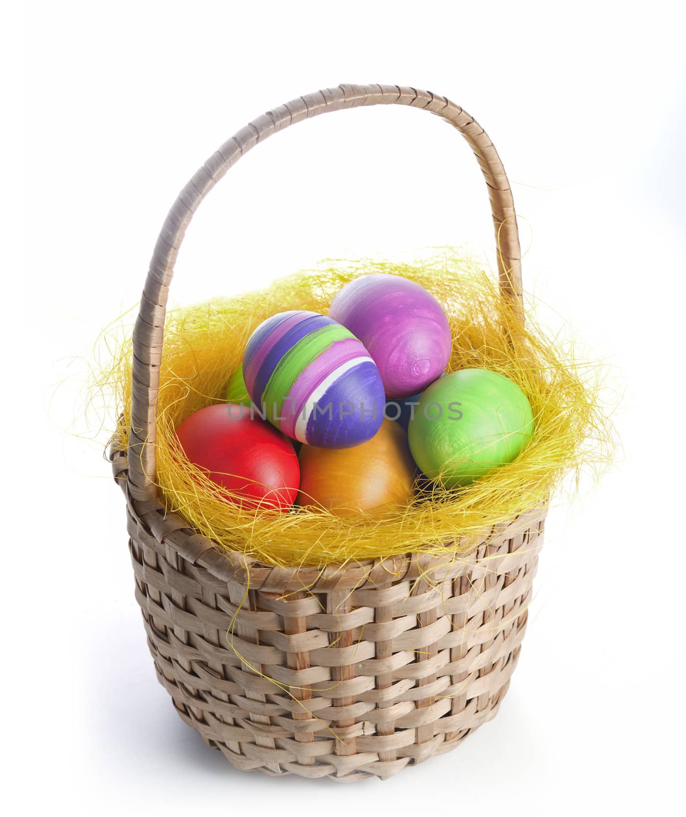 Coloured easter eggs in a braided basket