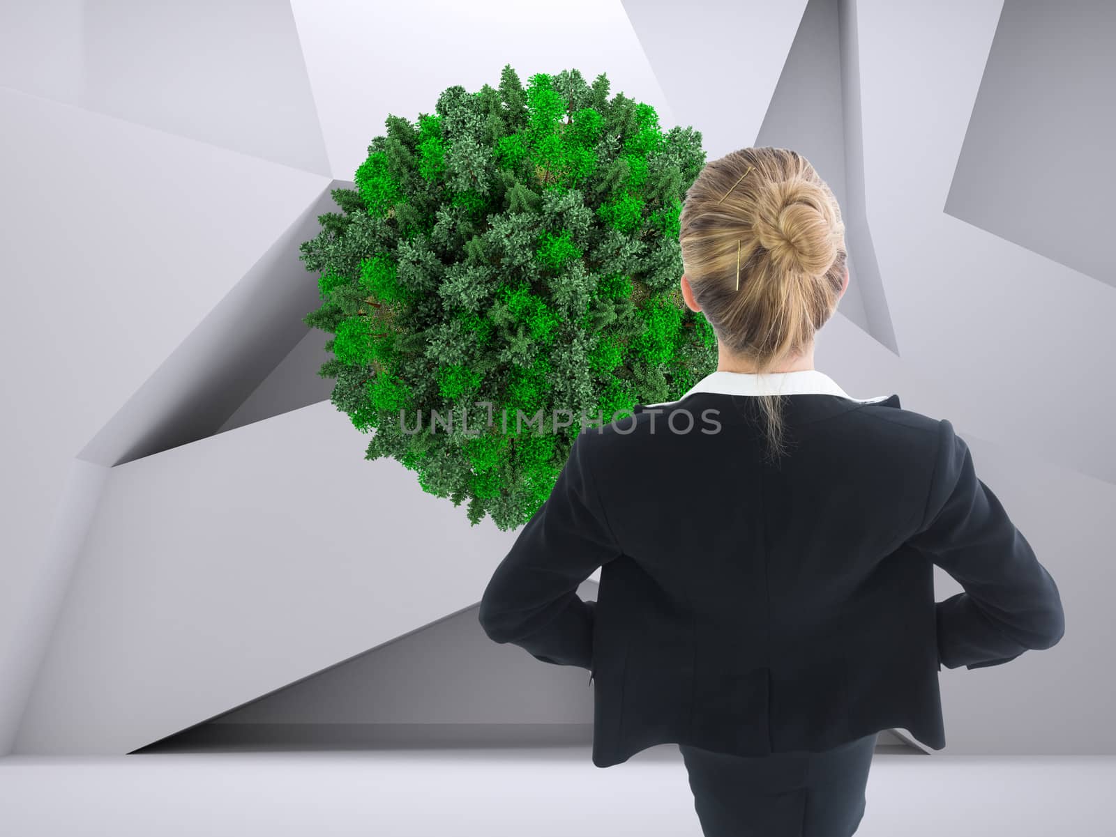 Composite image of blonde businesswoman standing with hands on hips