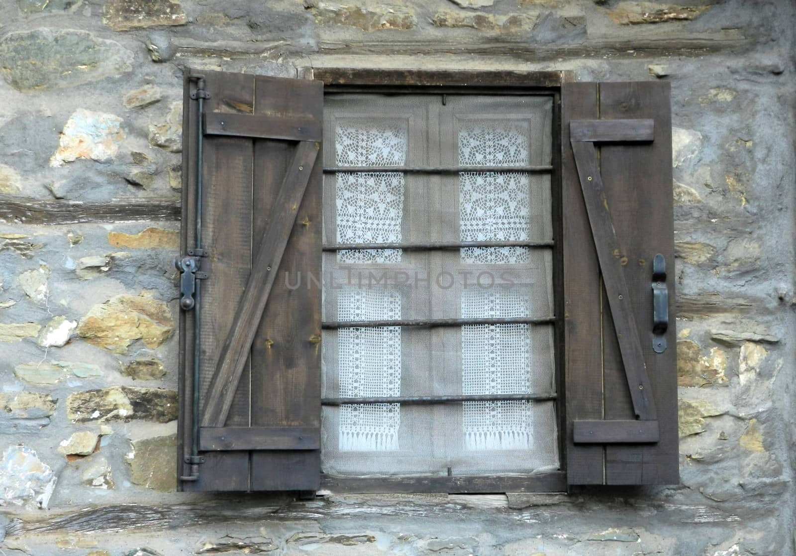 old window and rocky wall