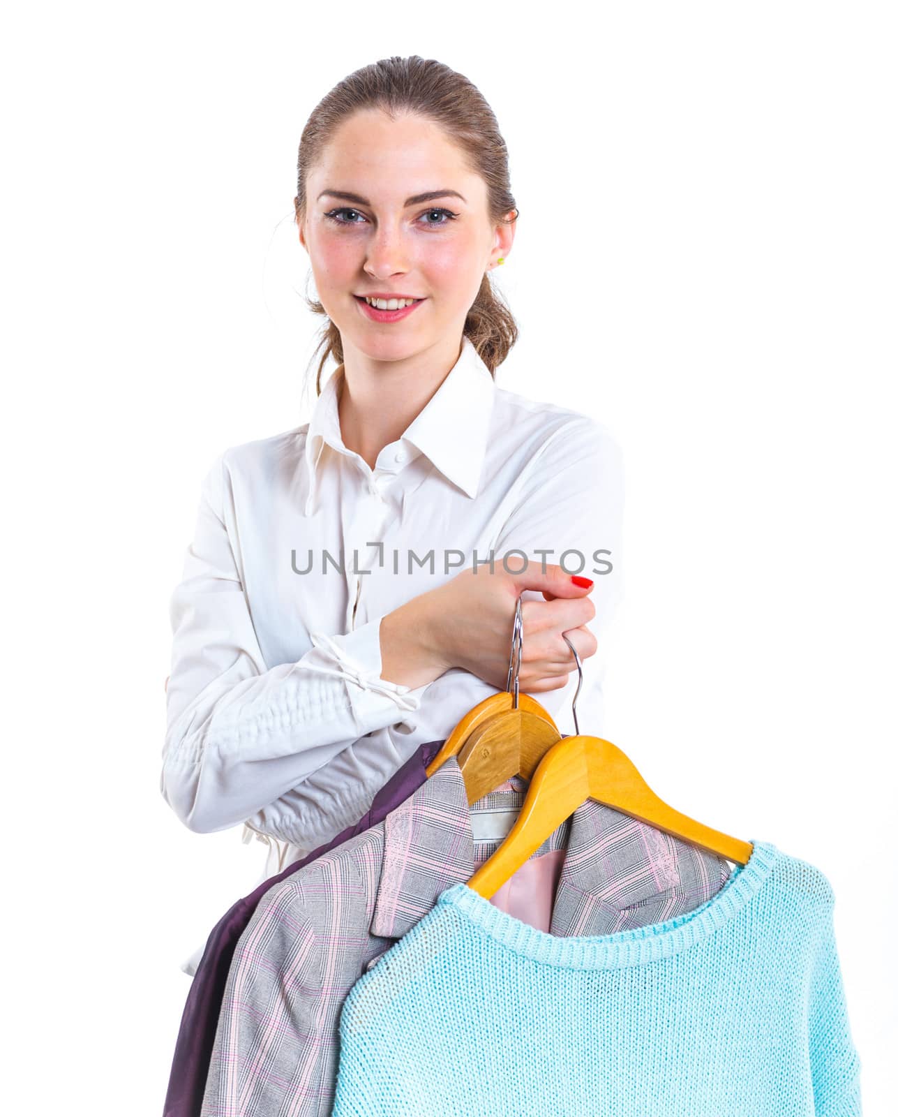 Studio picture of beautiful teenage girl with clothes. Isolated white background
