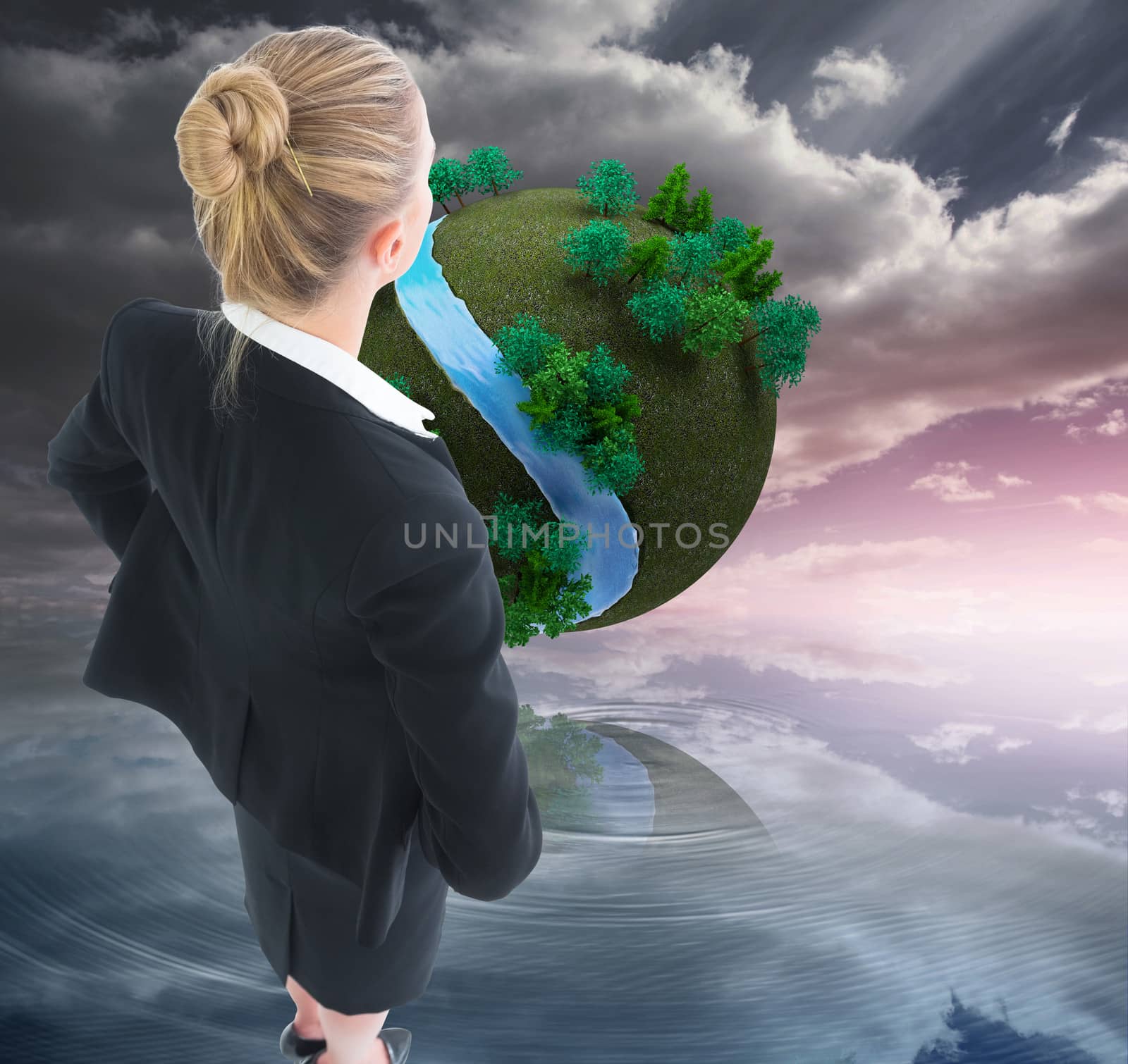 Composite image of blonde businesswoman standing with hands on hips