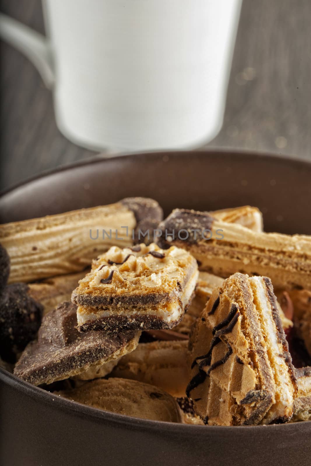 Close up of biscuits in a brown cup