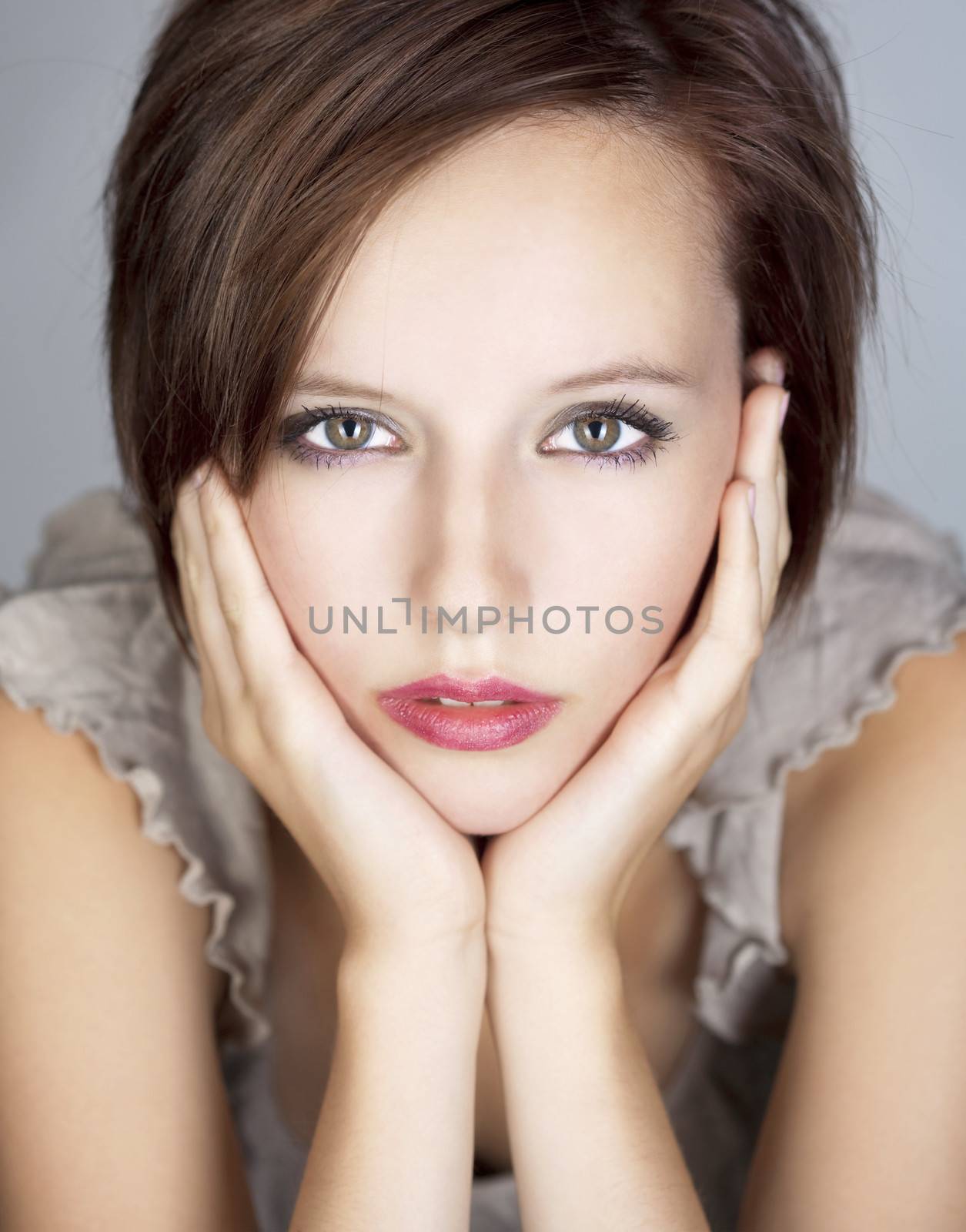 portrait of a beautiful teenage girl - isolated on gray