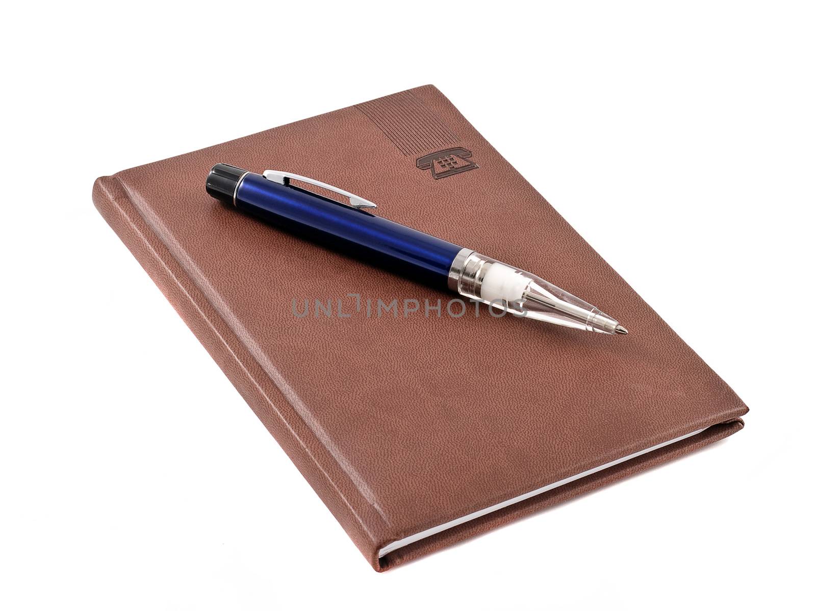 Notebook with blue pen, isolated on white background