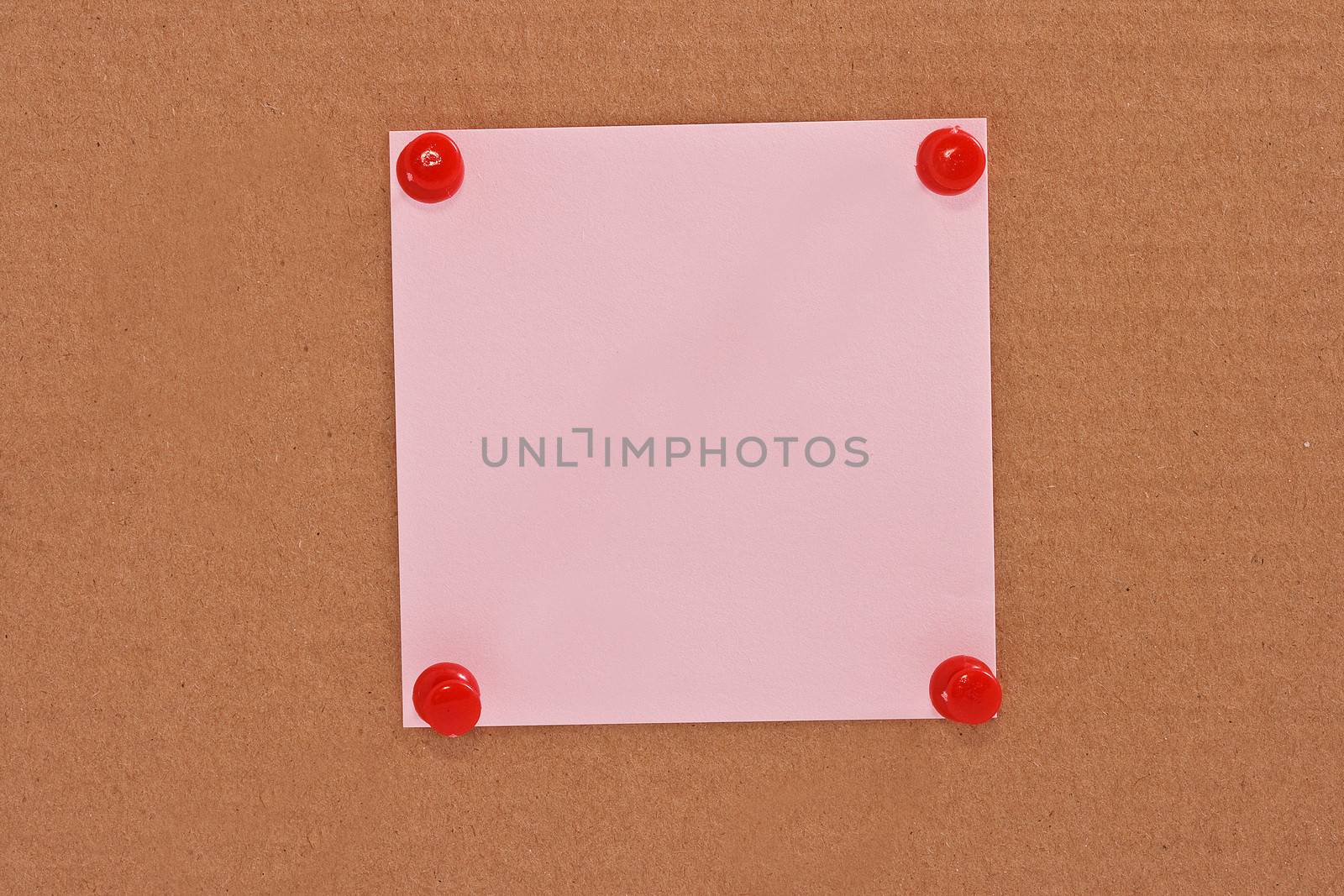 Pink note paper attached with red pins