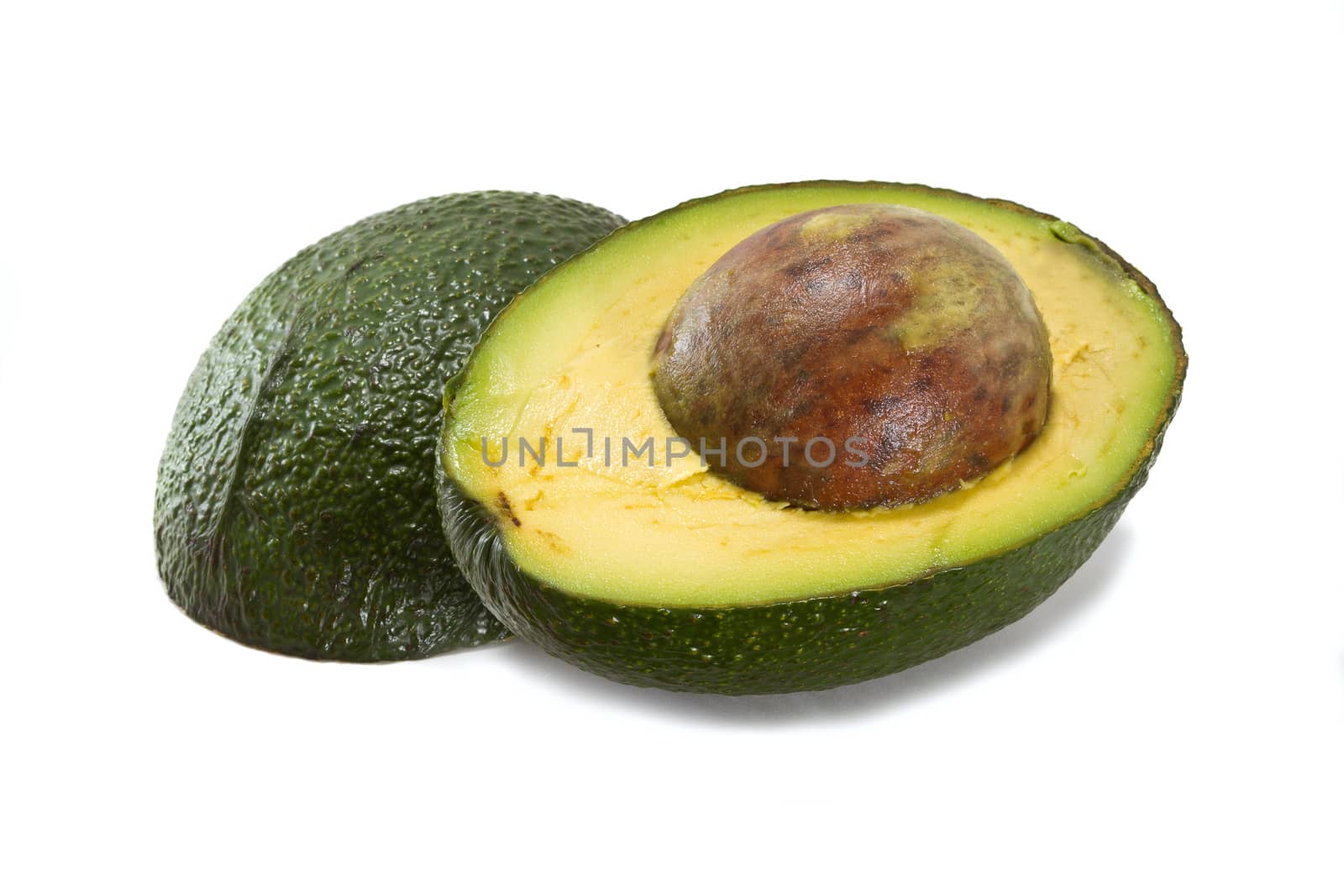 Halved avocado isolated on white background