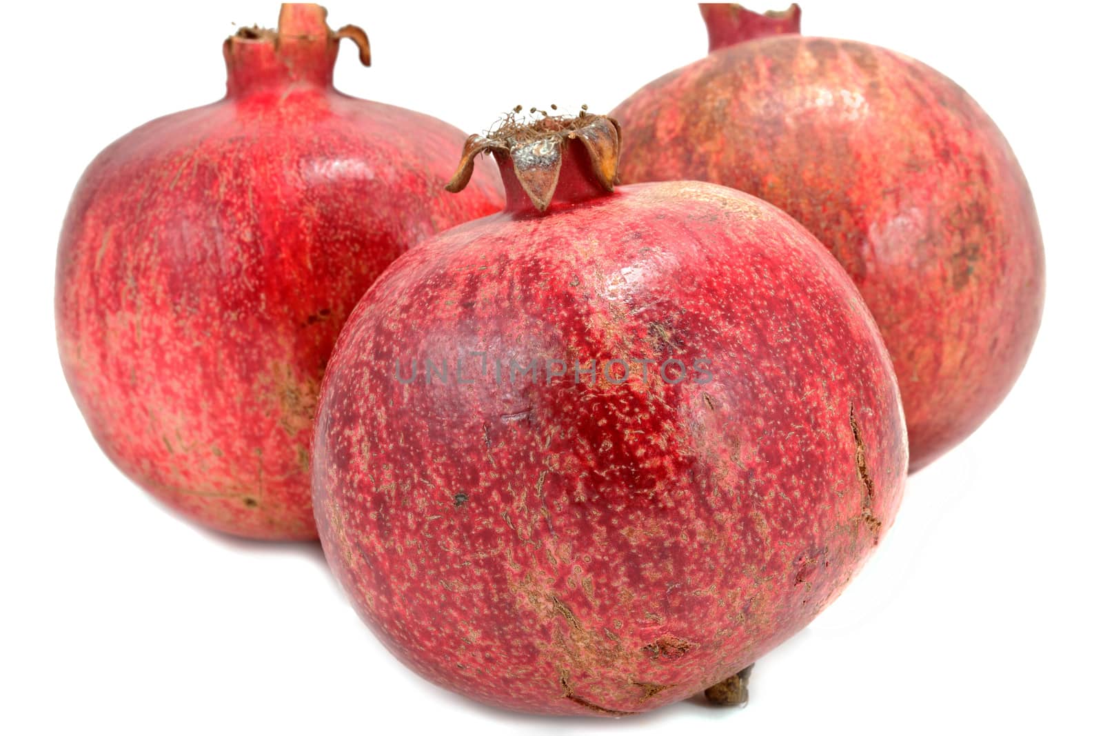 Ripe pomegranates isolated on white background