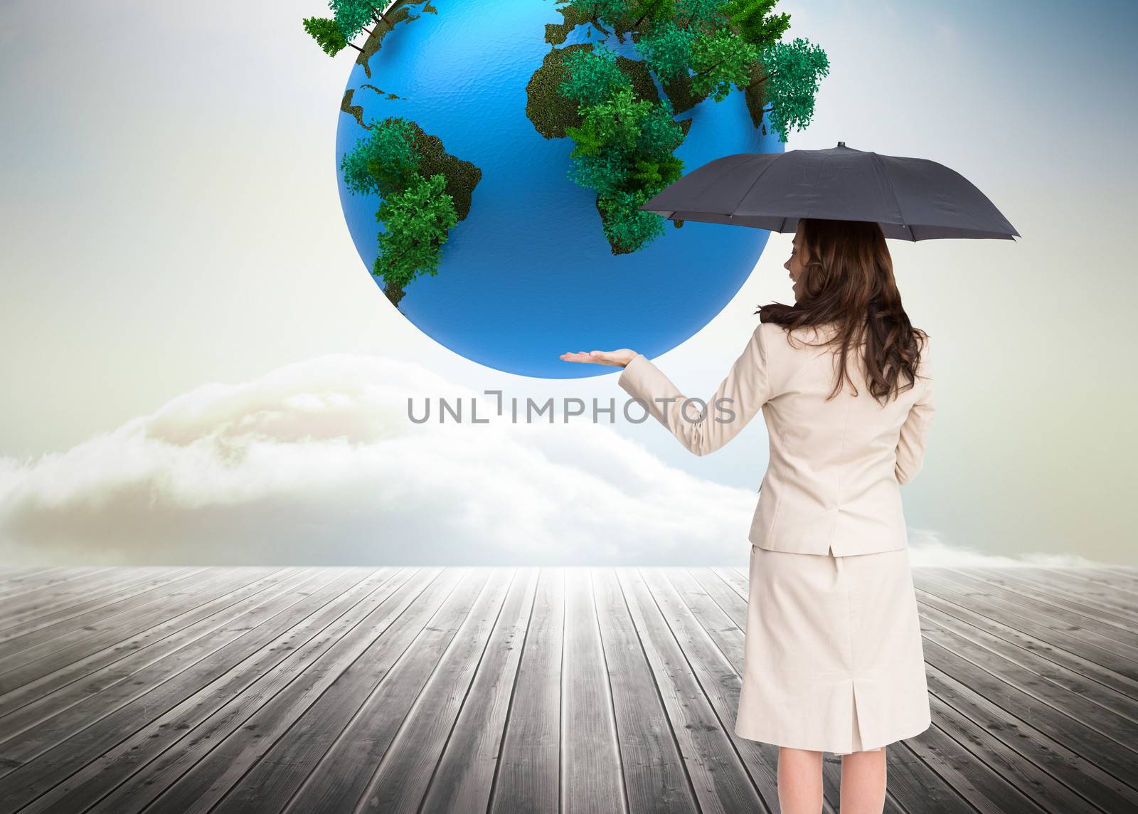 Composite image of elegant businesswoman holding black umbrella by Wavebreakmedia