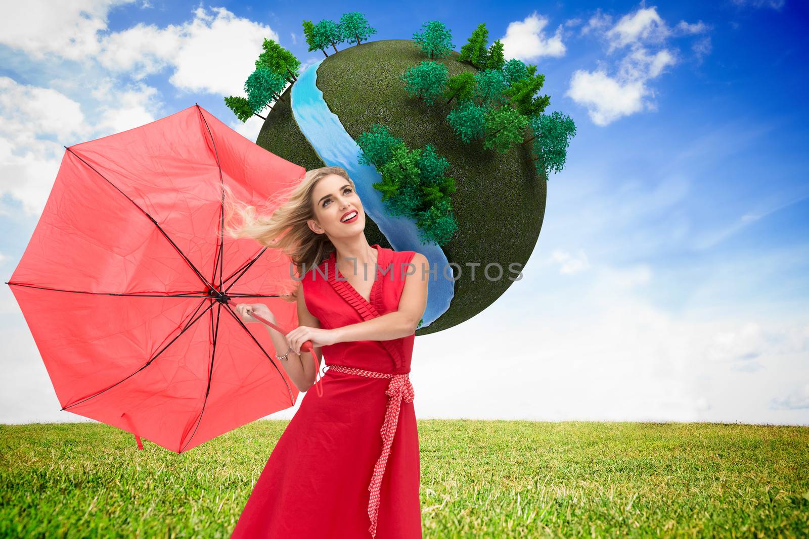 Composite image of elegant blonde holding umbrella by Wavebreakmedia