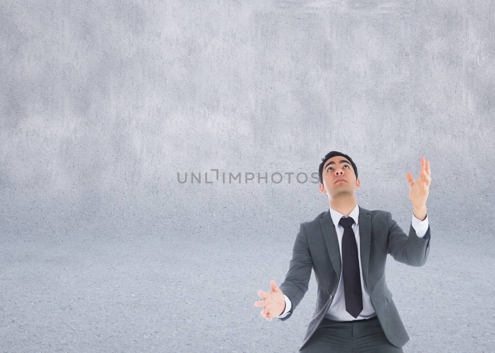 Composite image of unsmiling businessman catching by Wavebreakmedia