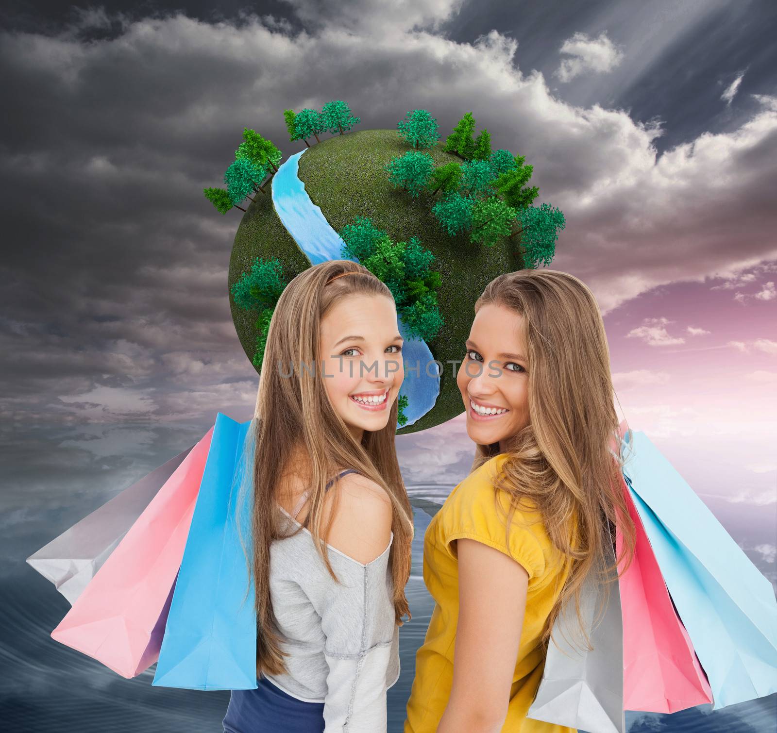 Composite image of two young women with shopping bags by Wavebreakmedia