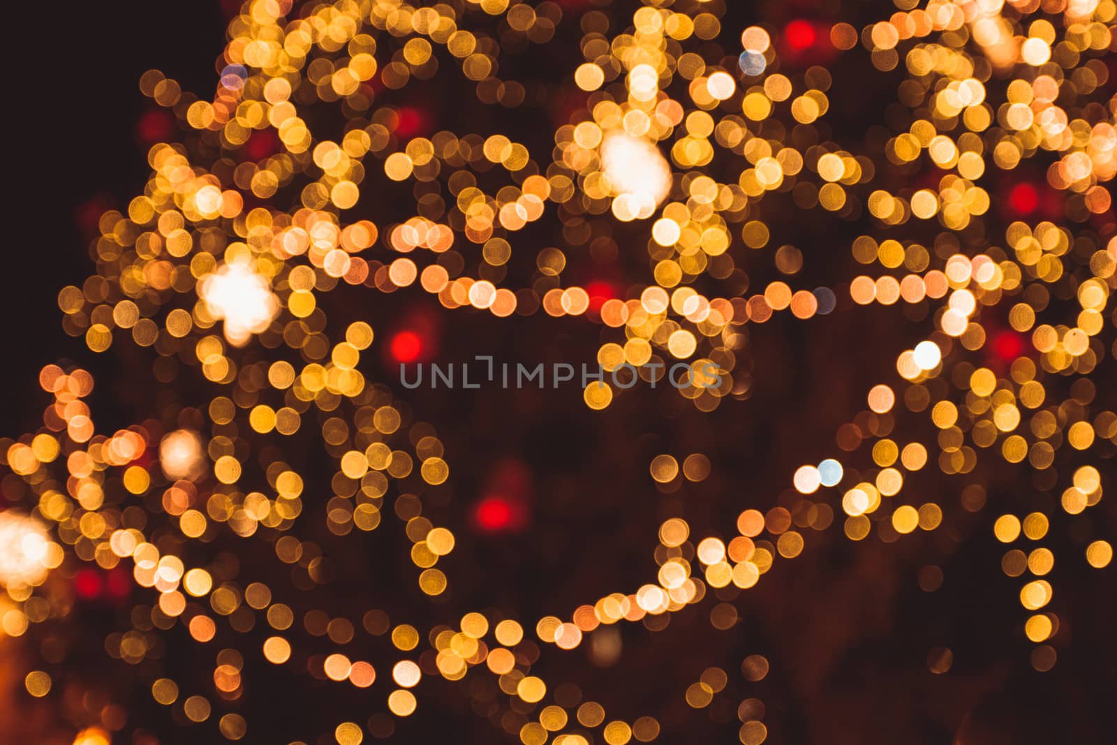 Defocused Christmas tree lights in the night