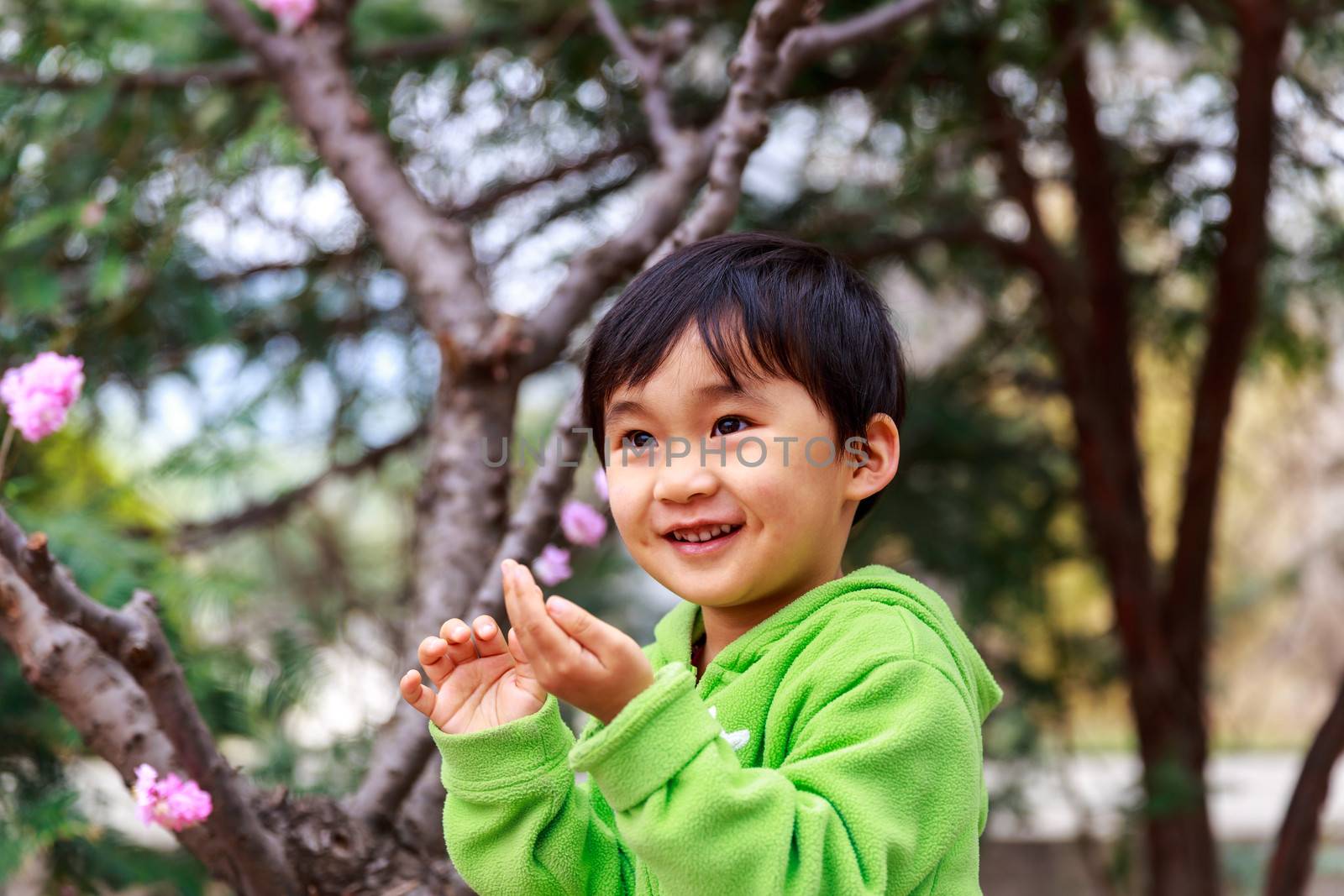 Adorable girl smiles in the woods