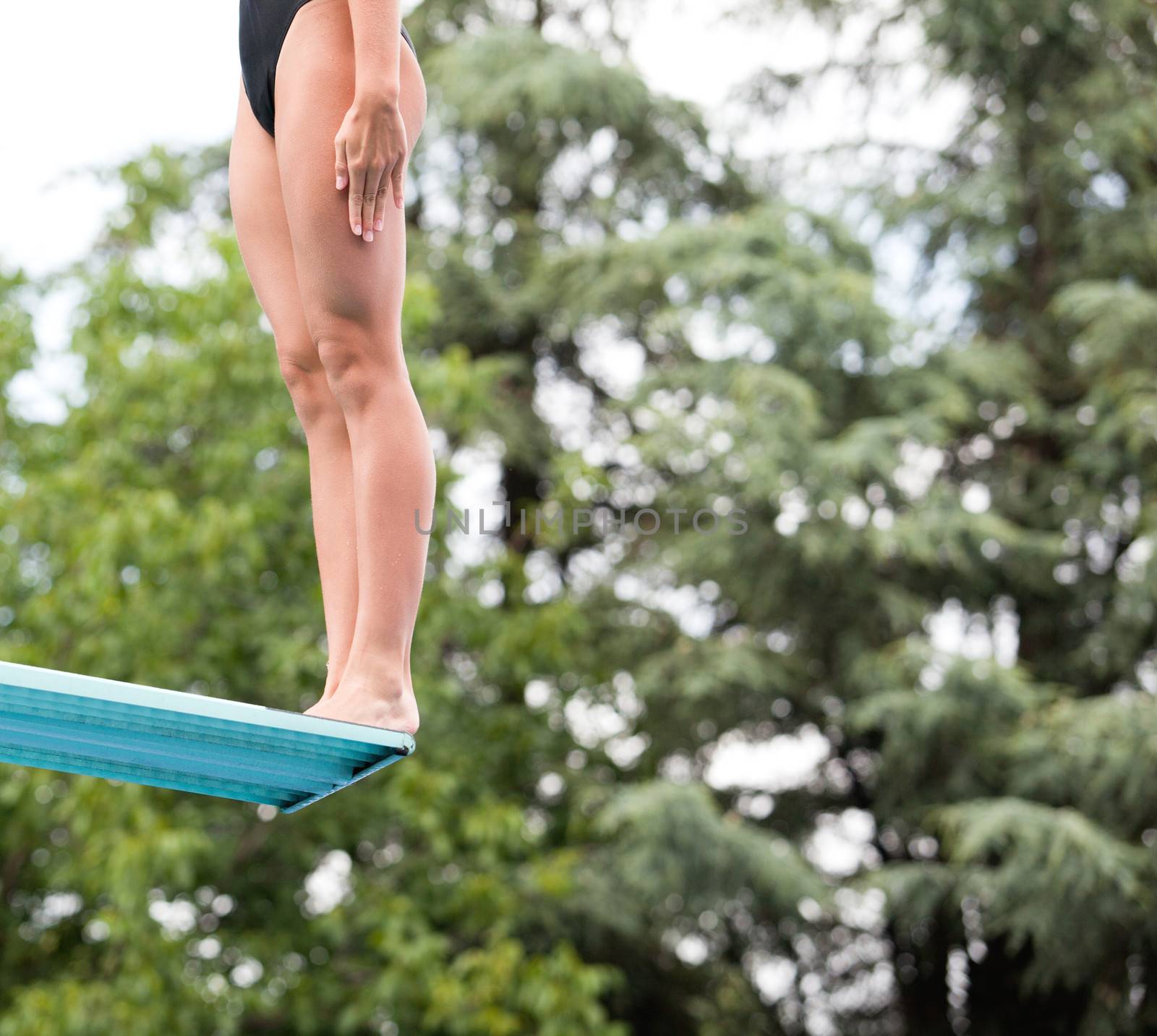 Preparing to dive into a swimming pool