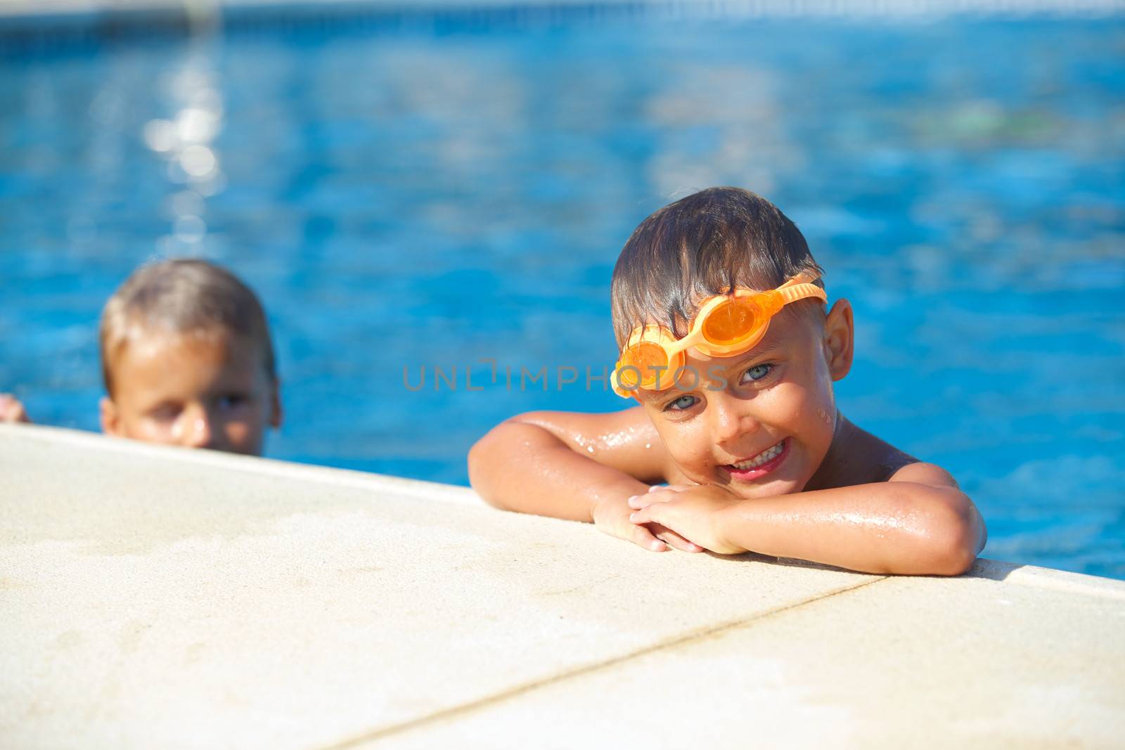Activities on the pool. Cute boy in swimming pool