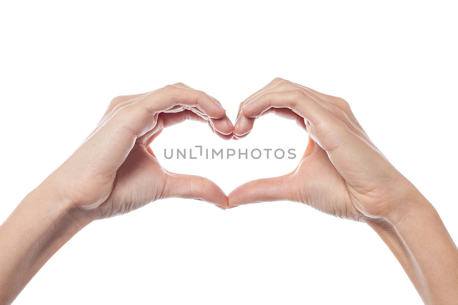 Woman hands make heart sign on the white background