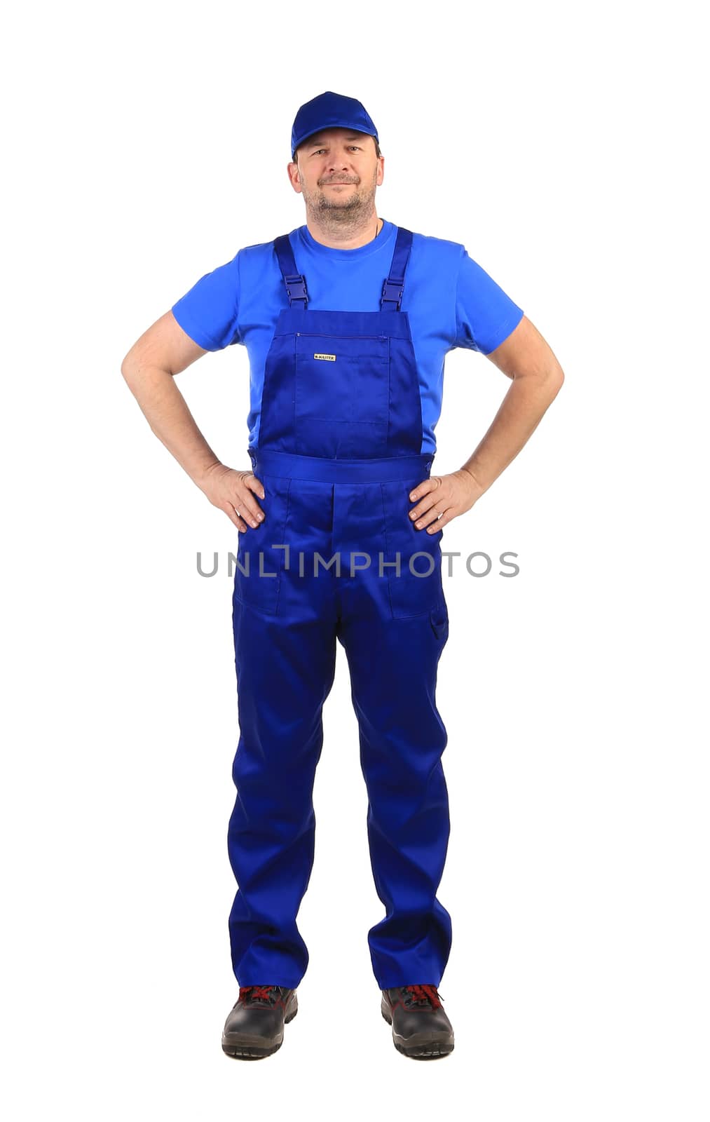 Worker in blue overalls. Isolated on a white background.