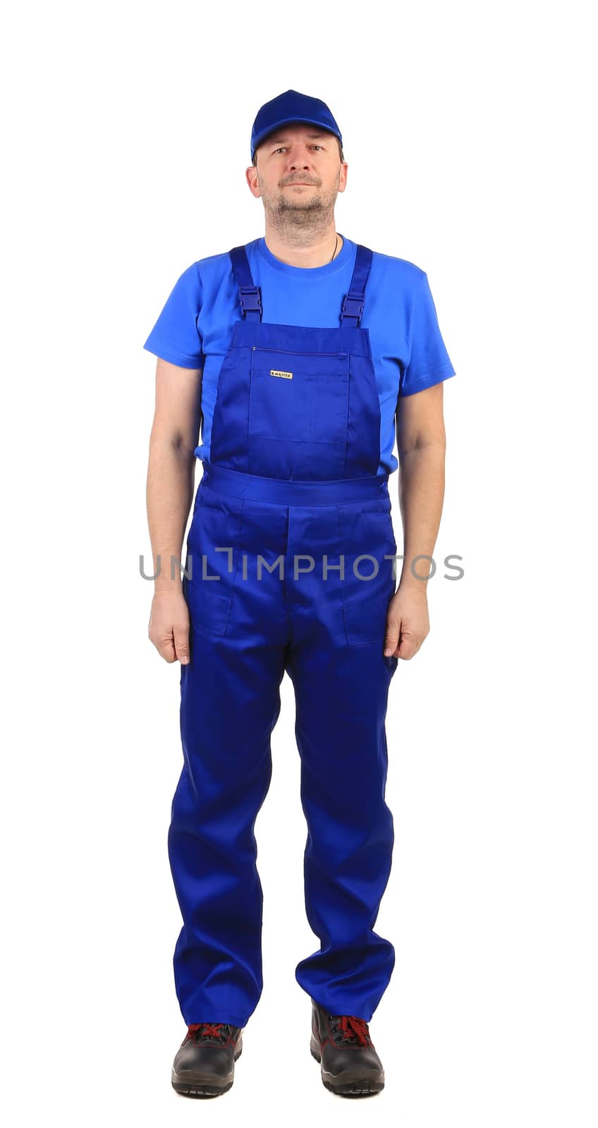 Worker in blue overalls. Isolated on a white background.