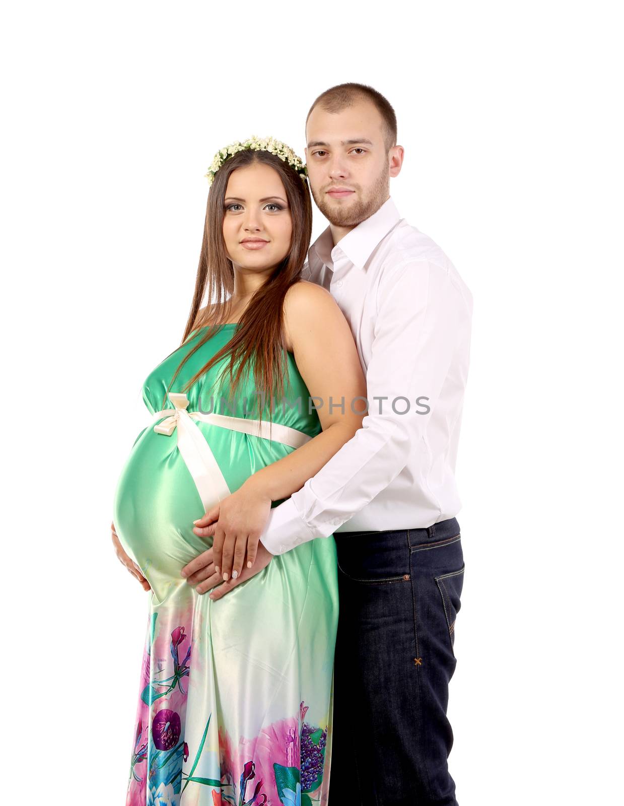 Happy couple expecting baby. Isolated on a white background.