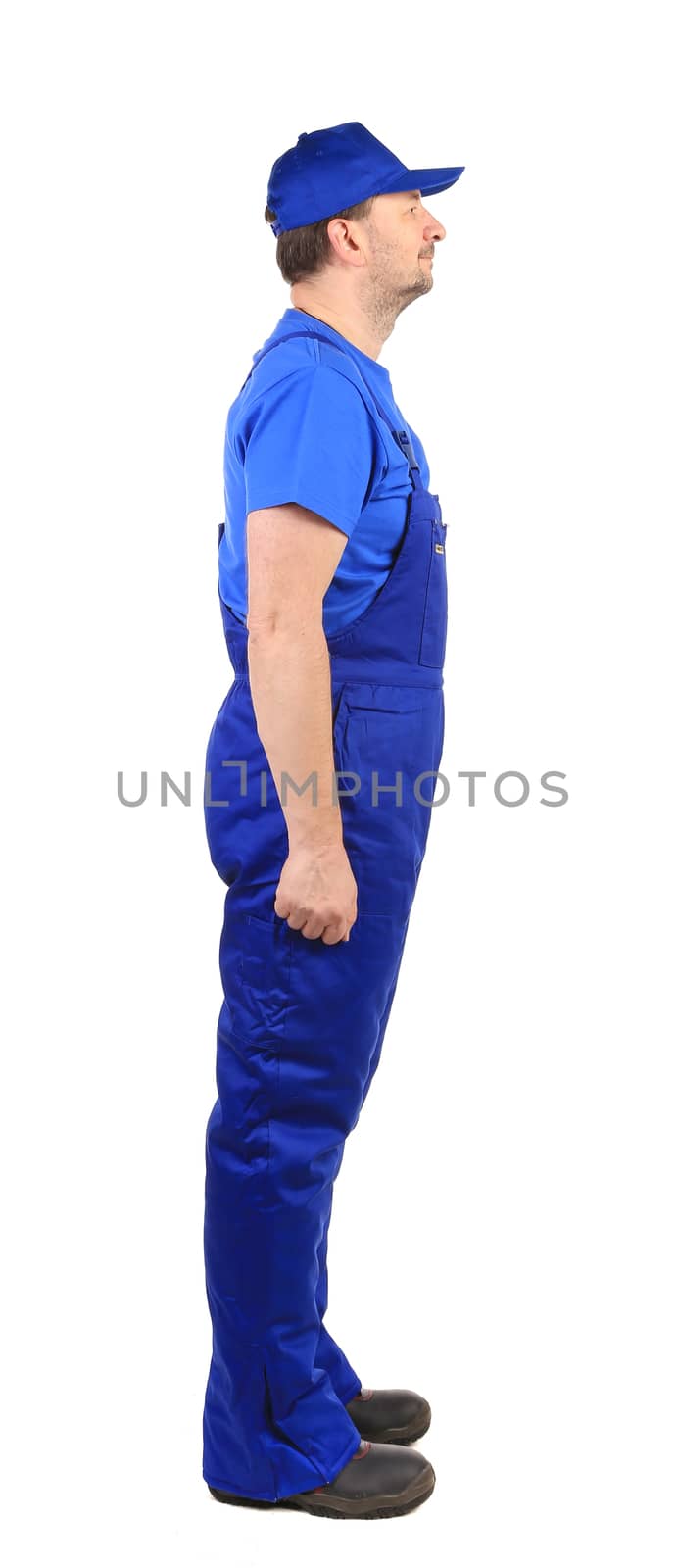 Worker in blue overalls. Side view. by indigolotos