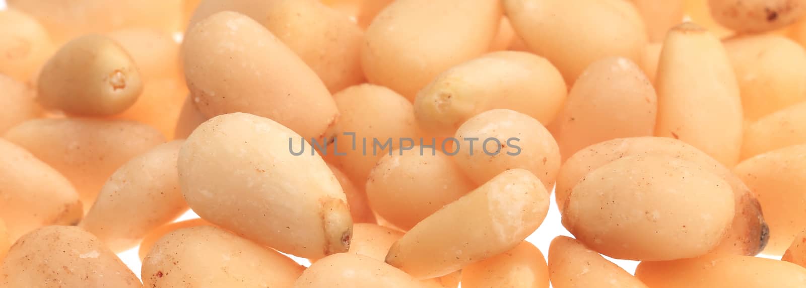 Background of pine nuts. Close up. Whole background.