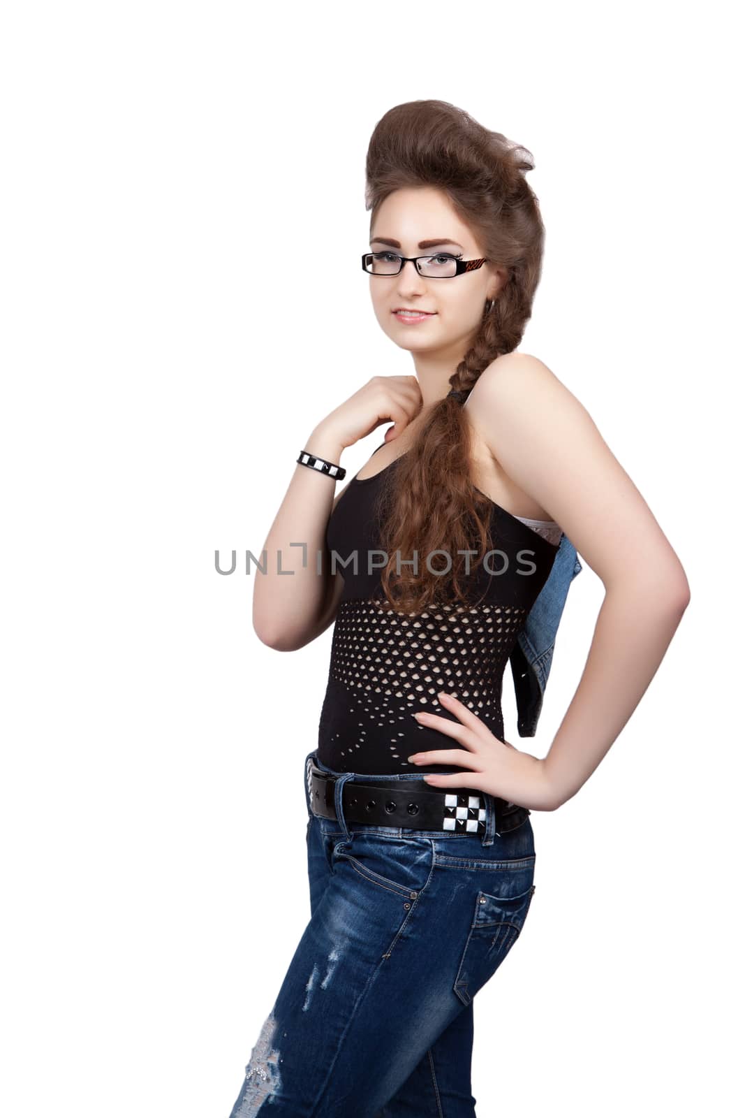 Teenage girl in a blue jeans dress with jacket over shoulder, isolated on white background