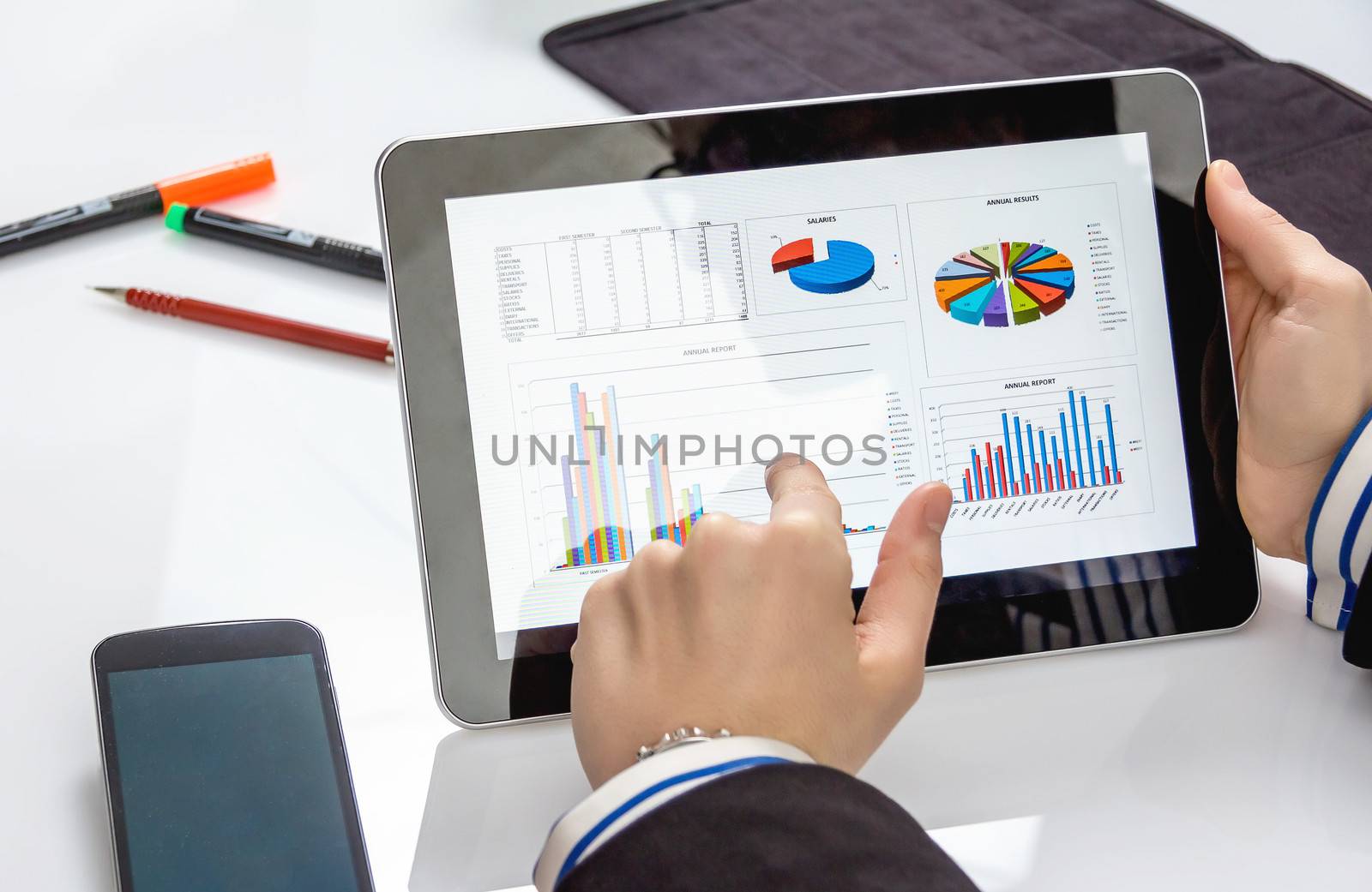 Businesswoman showing documents in digital tablet by doble.d