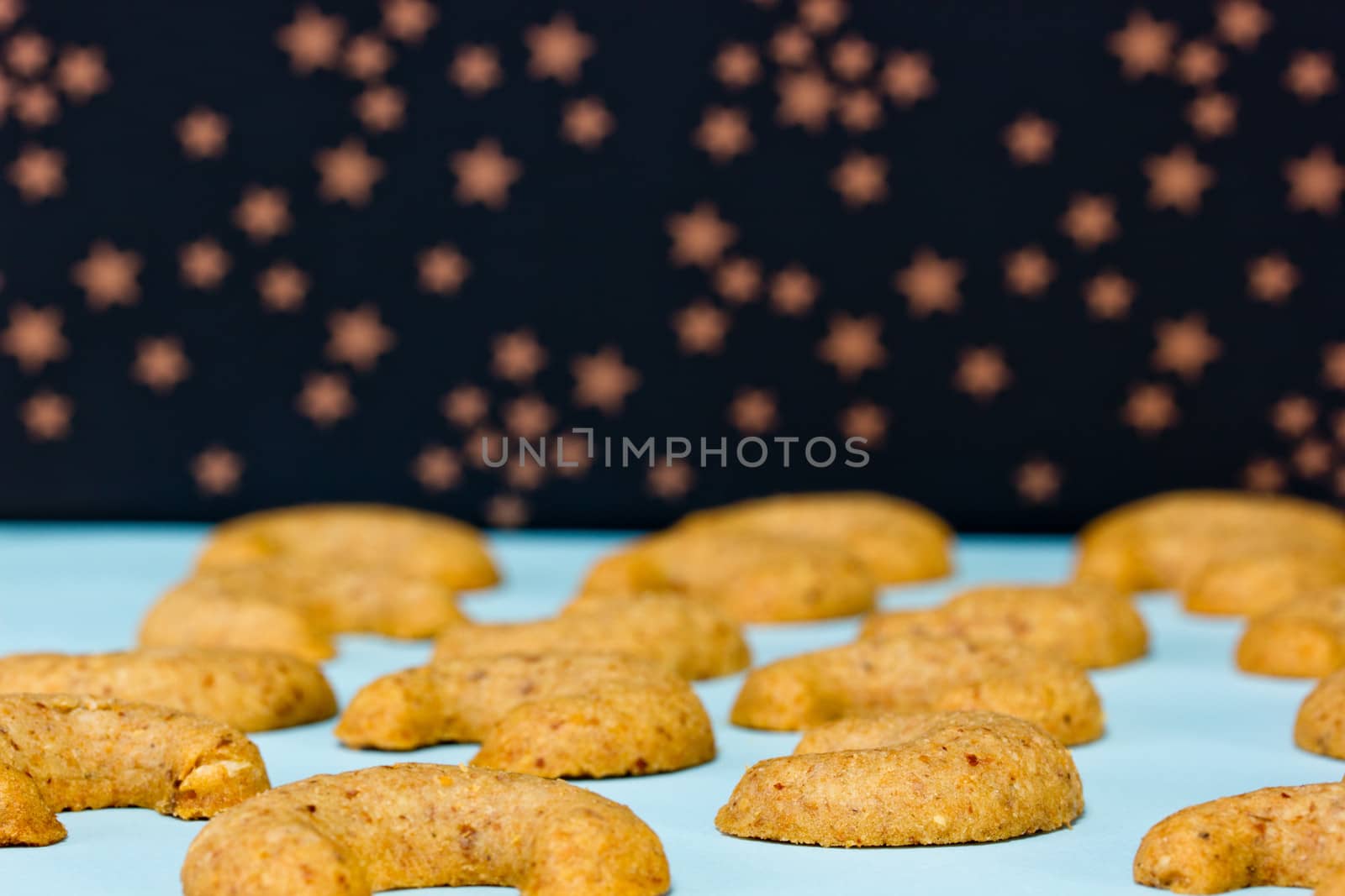 Fresh baked vanillekipferl with starry background