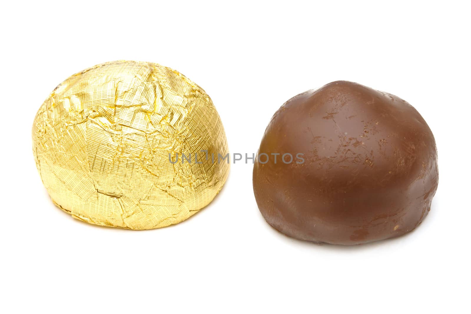 Chocolate pralines on white background